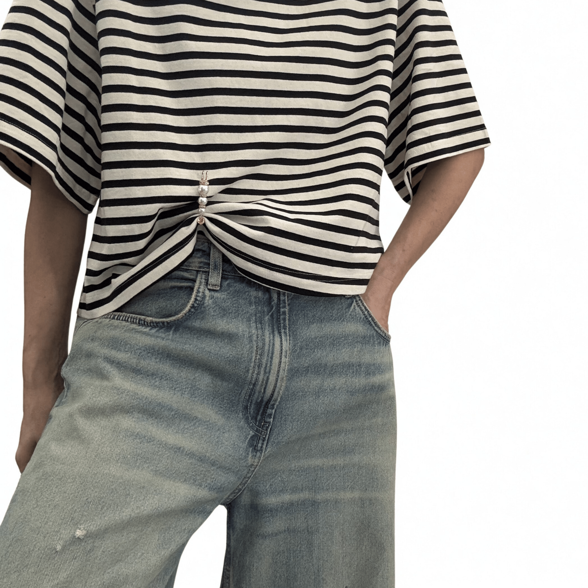 Double sided pearl pin styled to crop a boxy striped tee paired with oversized denim.