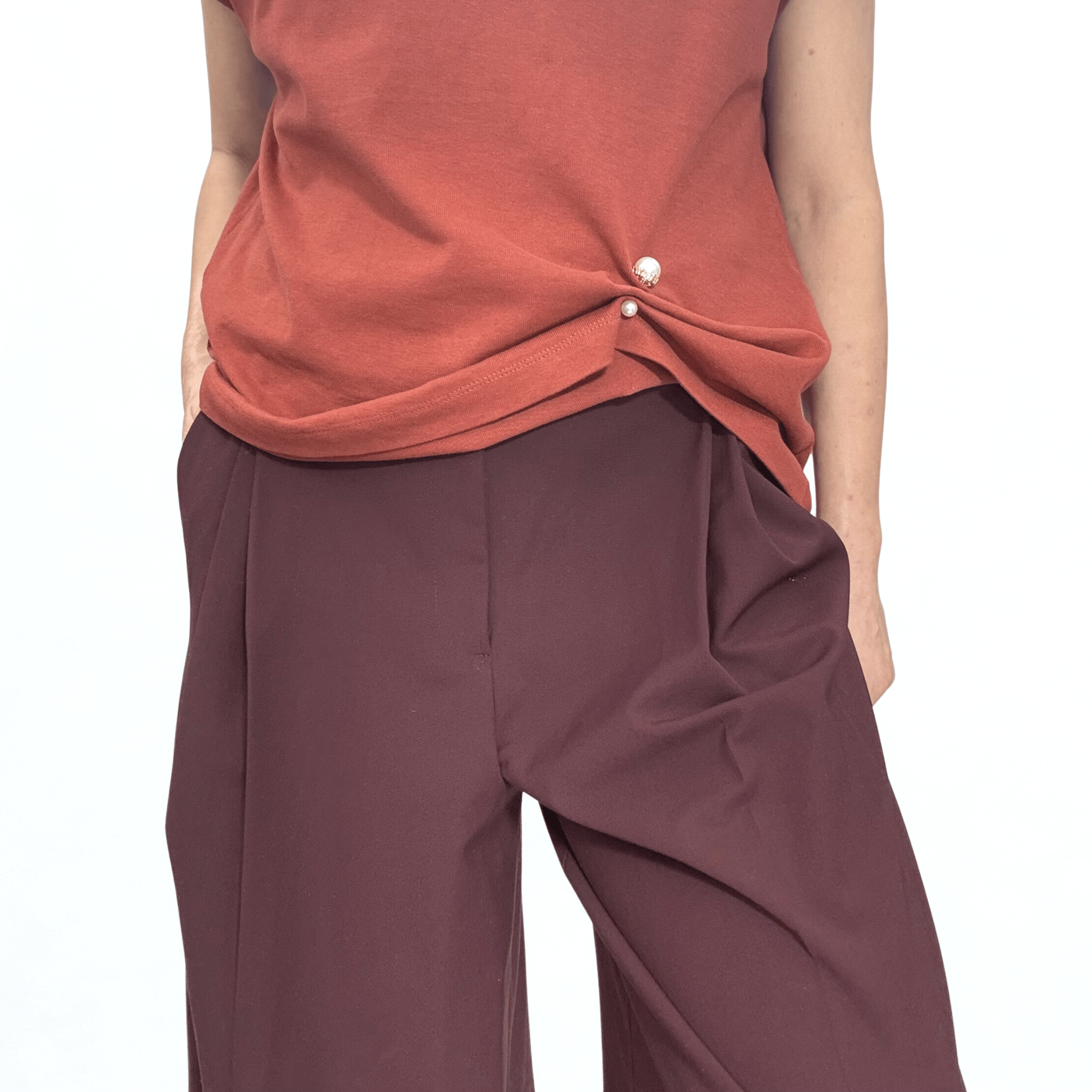 Double sided pearl pin styled to crop a boxy striped tee paired with wide leg trousers..