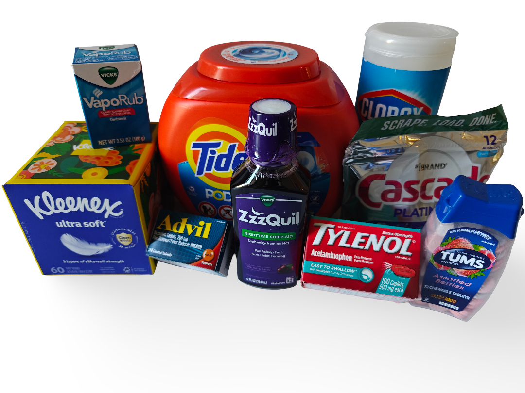 Collection of healthcare and household products including Vicks VapoRub, Kleenex tissues, Tide detergent, Clorox wipes, Cascade dishwasher pods, Tylenol, Tums, Advil, and ZzzQuil sleep aid.