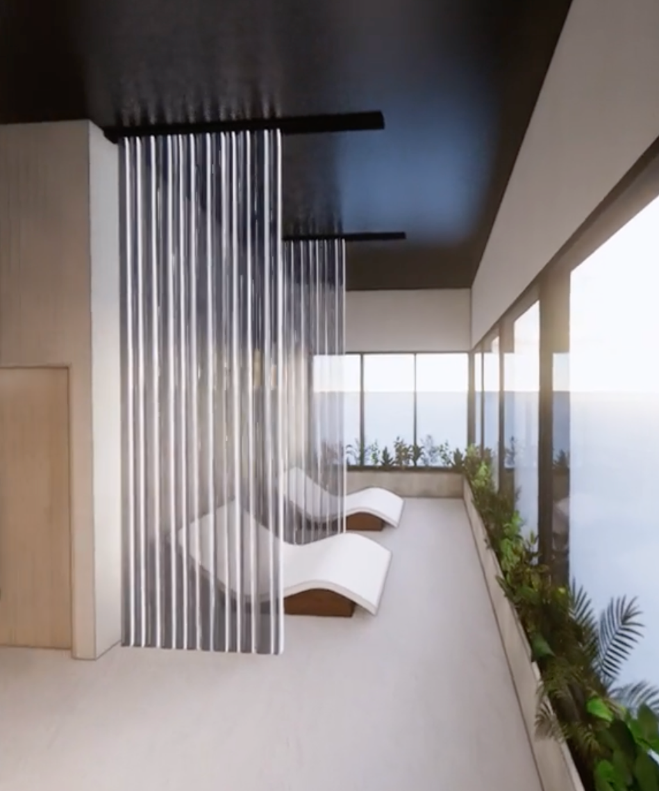 Balcony with two white lounge chairs, glass railing, potted plants, and ocean view in the background