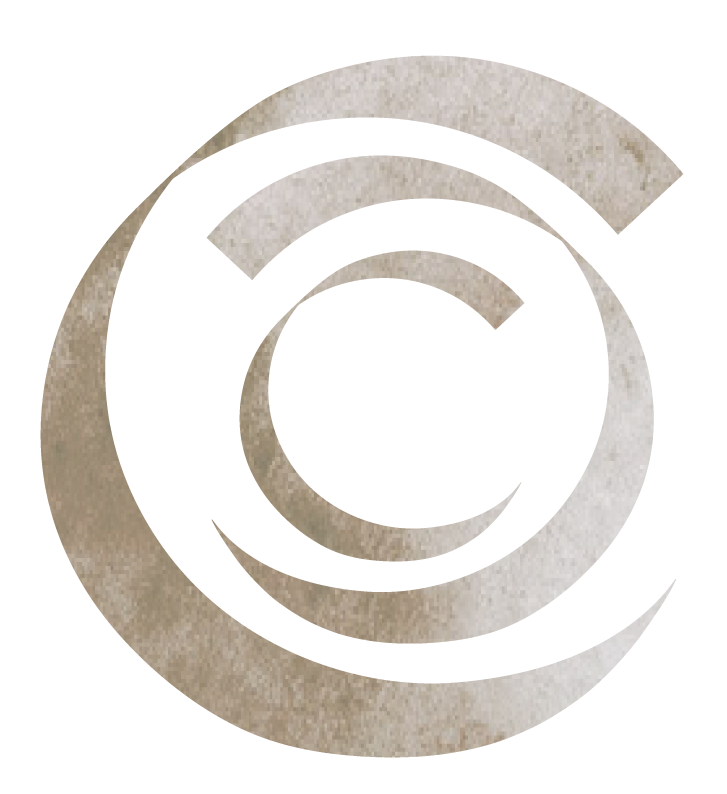 Close-up of a stylized, sand-colored letter 'C' with a textured appearance.