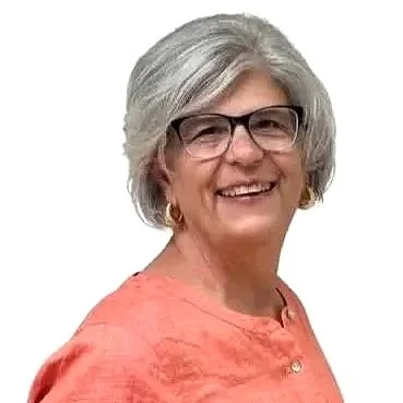 Portrait of Cathy Sheafor, children's fiction picture book author, environmental justice biographer, smiling at the camera.