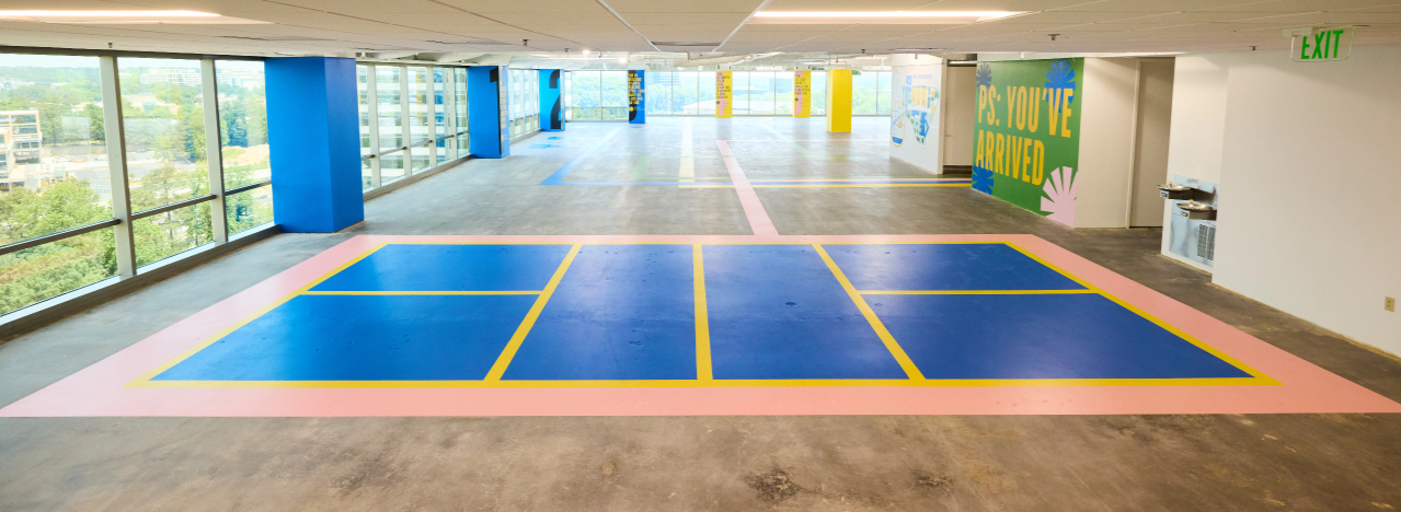 Pickle ball court floor graphics in leasing room