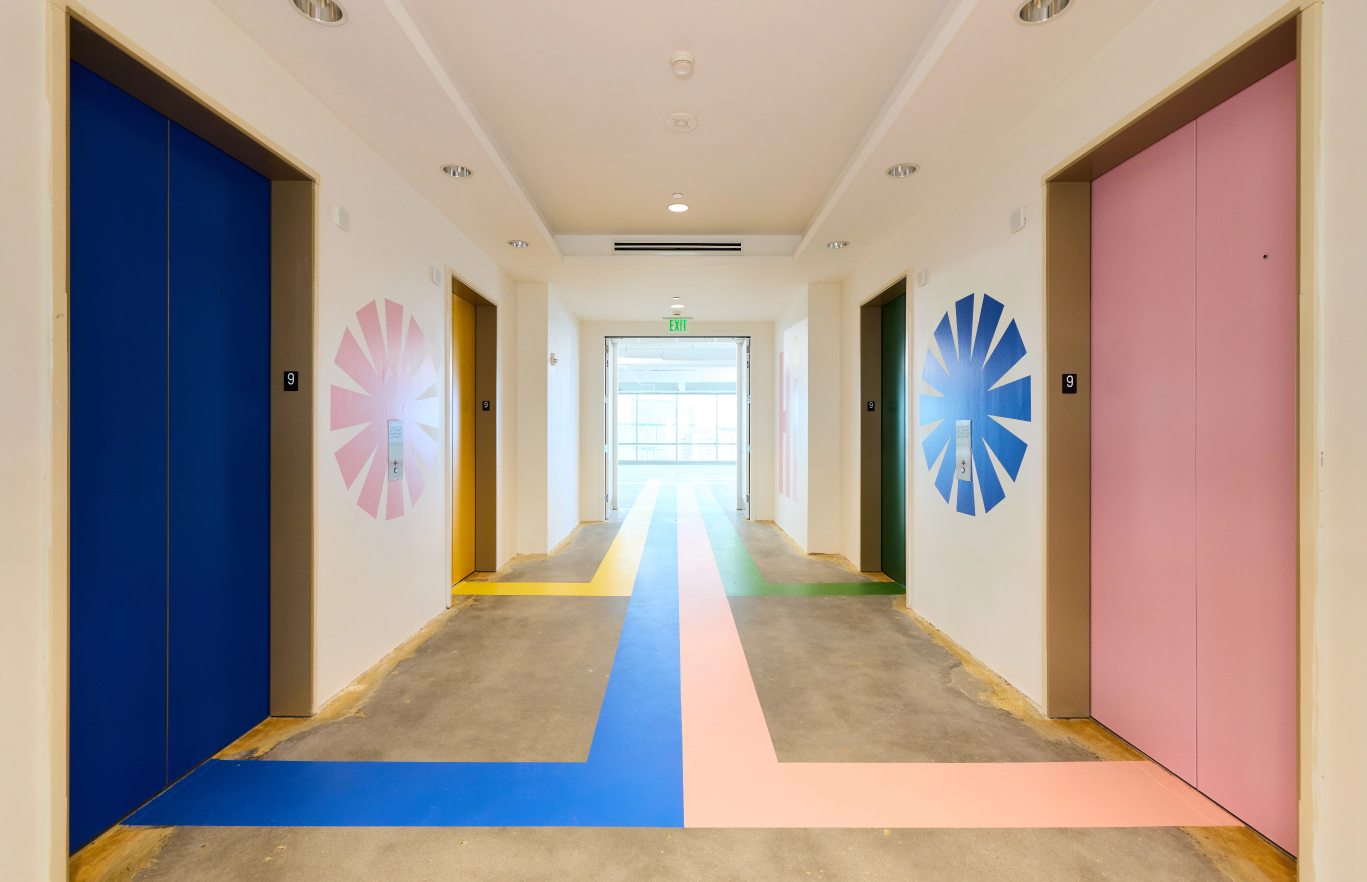 Entrance elevator banks with floor graphics and wall graphics
