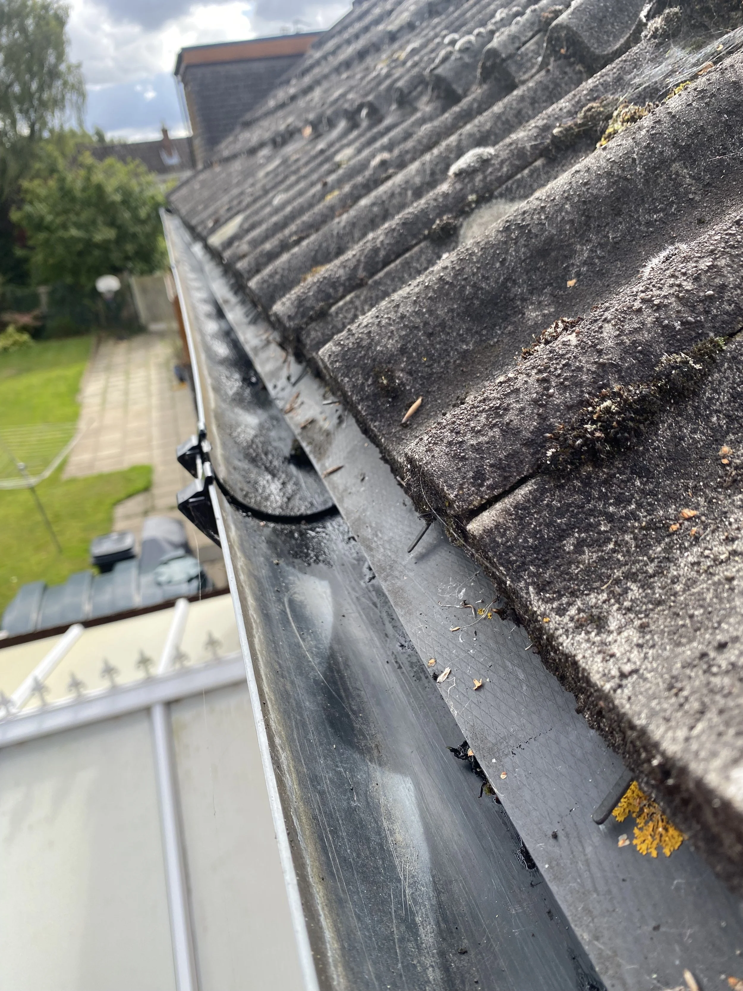 Close-up of a clear gutter with no blockages.