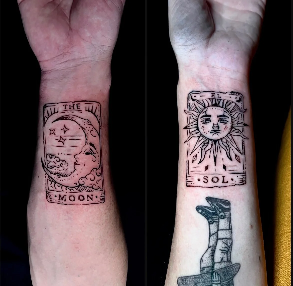 Tattoo of the moon and sun tarot cards on wrists, with a small tattoo of a hand holding a skateboard below the sun card.