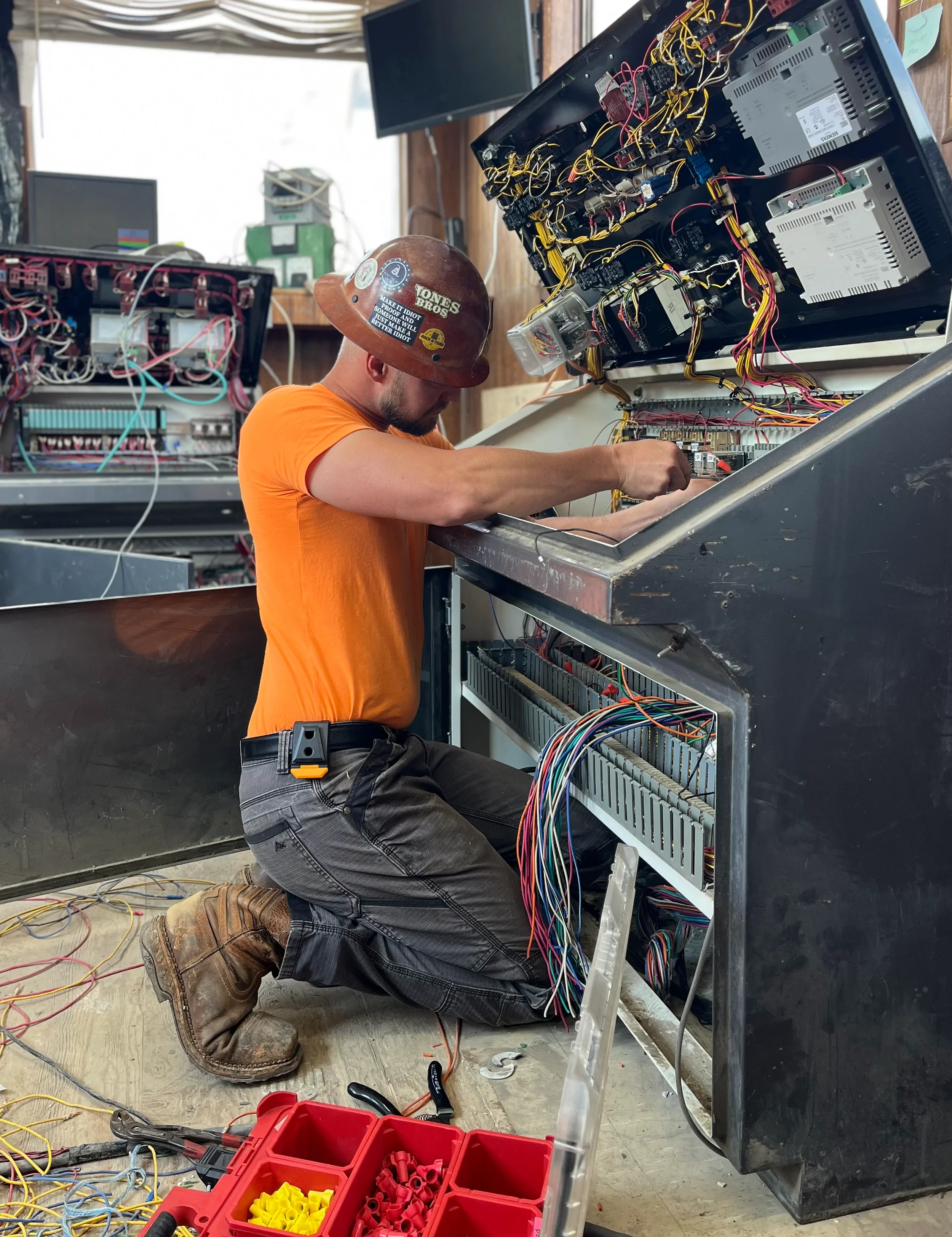 Maximum-Electric-LLC-Industrial-electrical-contractors-working-on-motor-controls-and-cp controls.webp