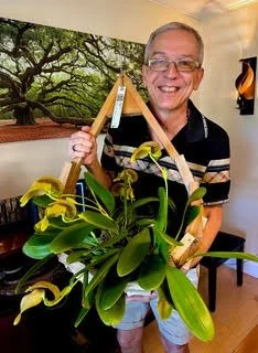 Olivier holding his Bulbophyllum grandiflorum