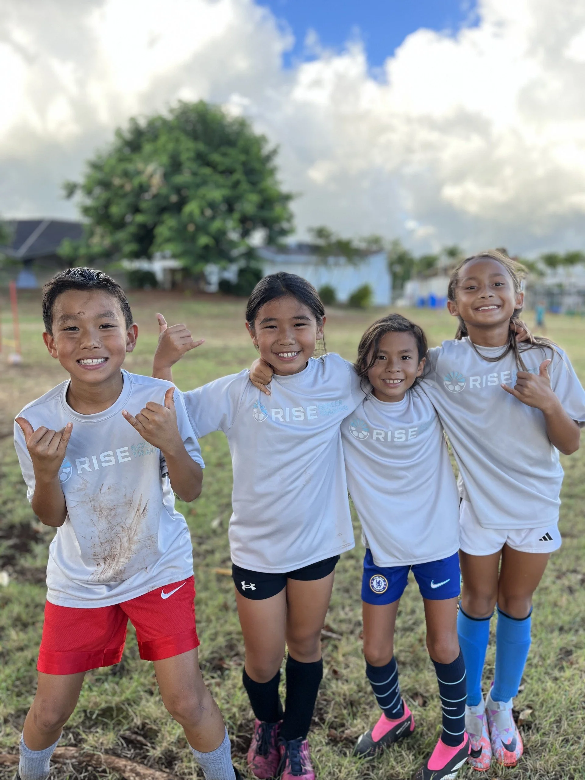 Youth soccer players smiling during practice