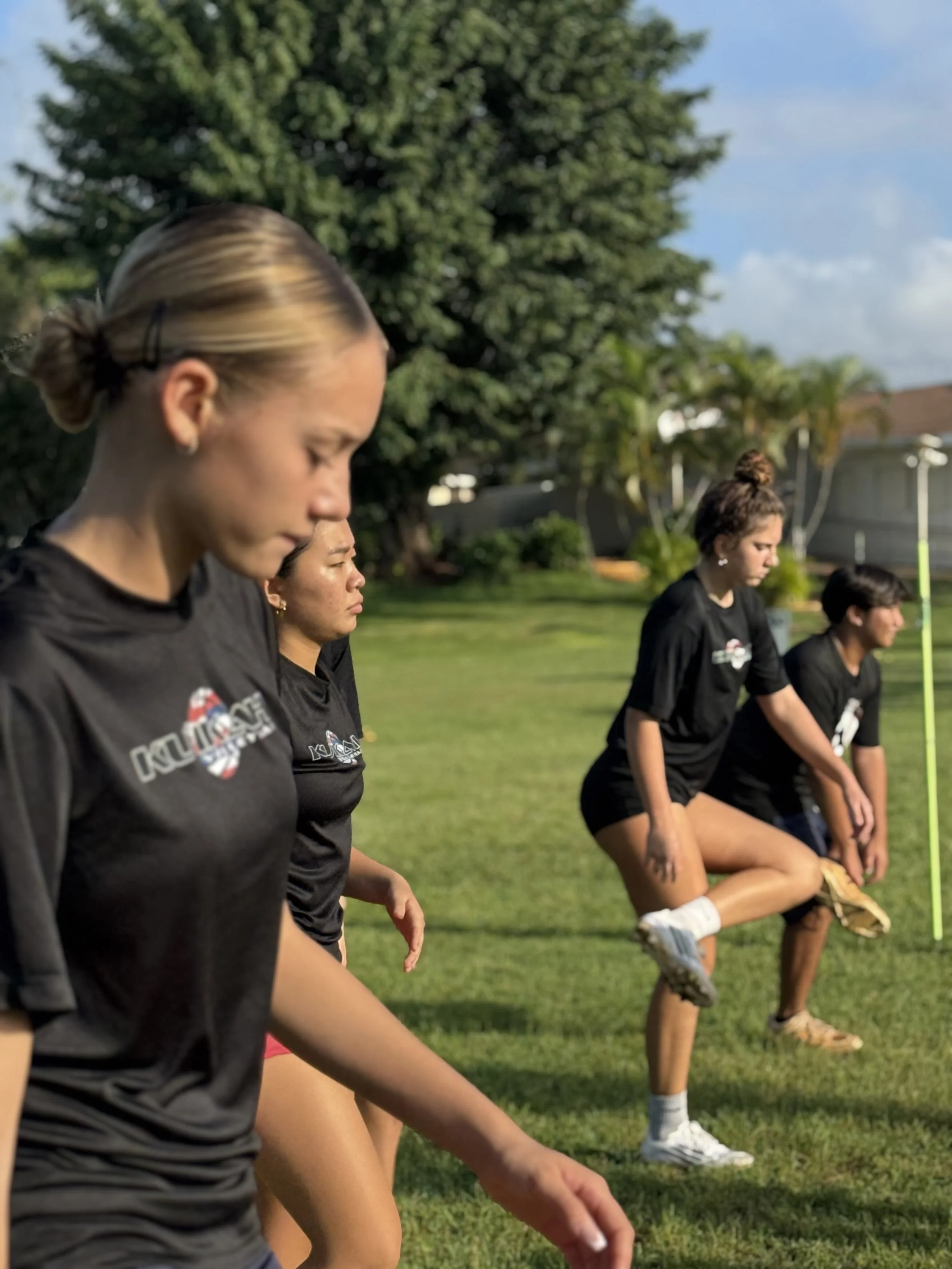 Volleyball athletes warm up before agility training
