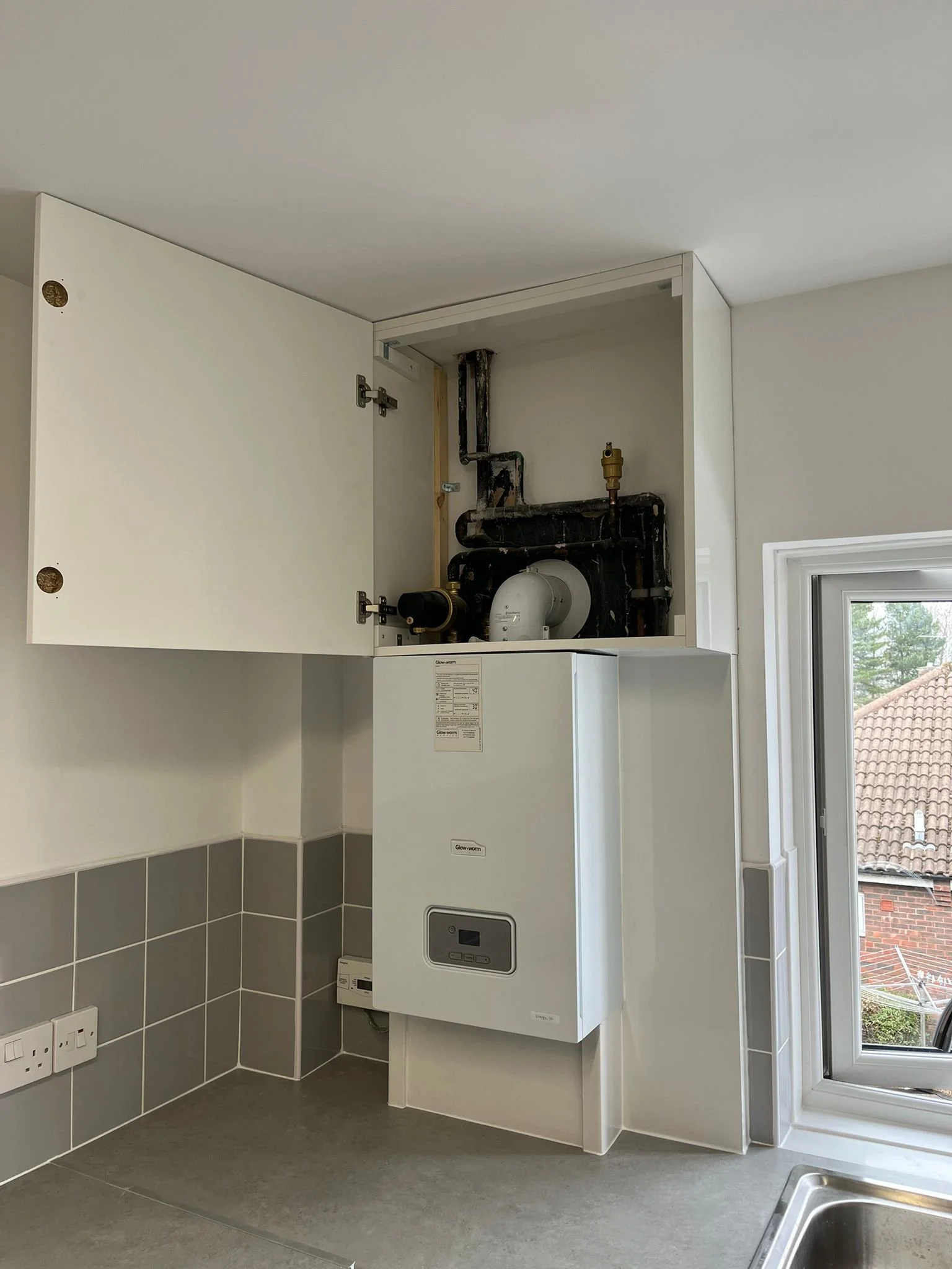 Boxing in and utility cupboard over a new boiler installation.