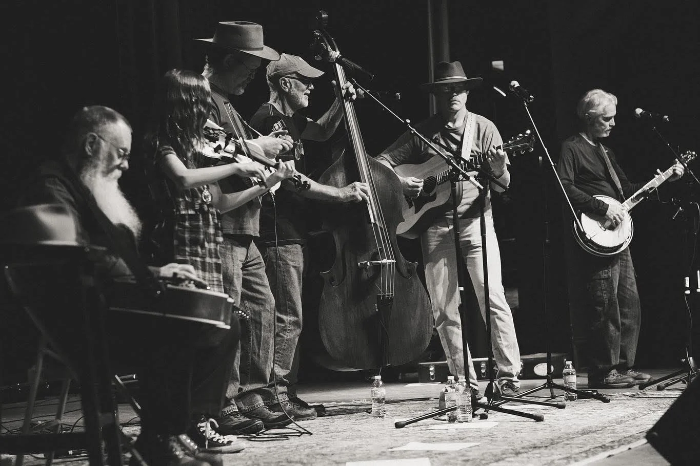 black and white photo of Keweenaw Brewgrass performing on Calumet Theater.