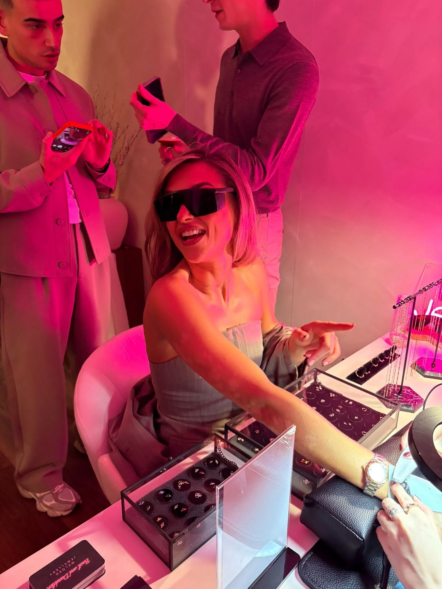 A woman getting permanent welded jewellery at her birthday party event. Welded Jewellery pop up at events.