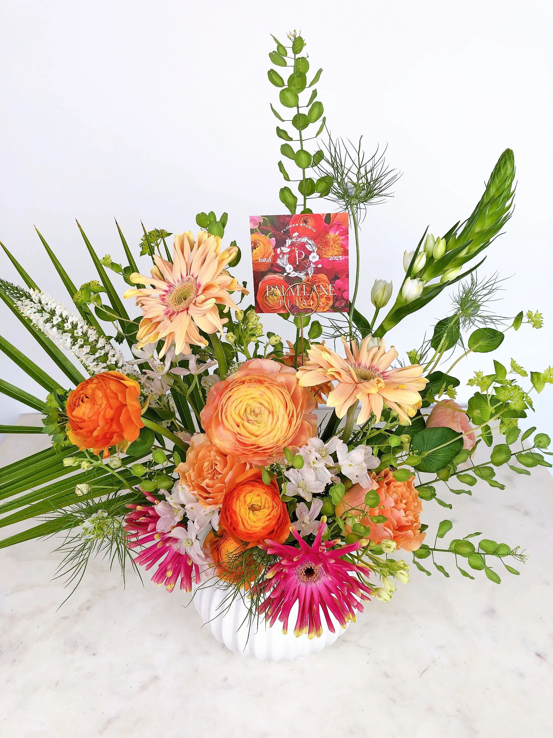 Island Glow Deluxe Arrangement $85