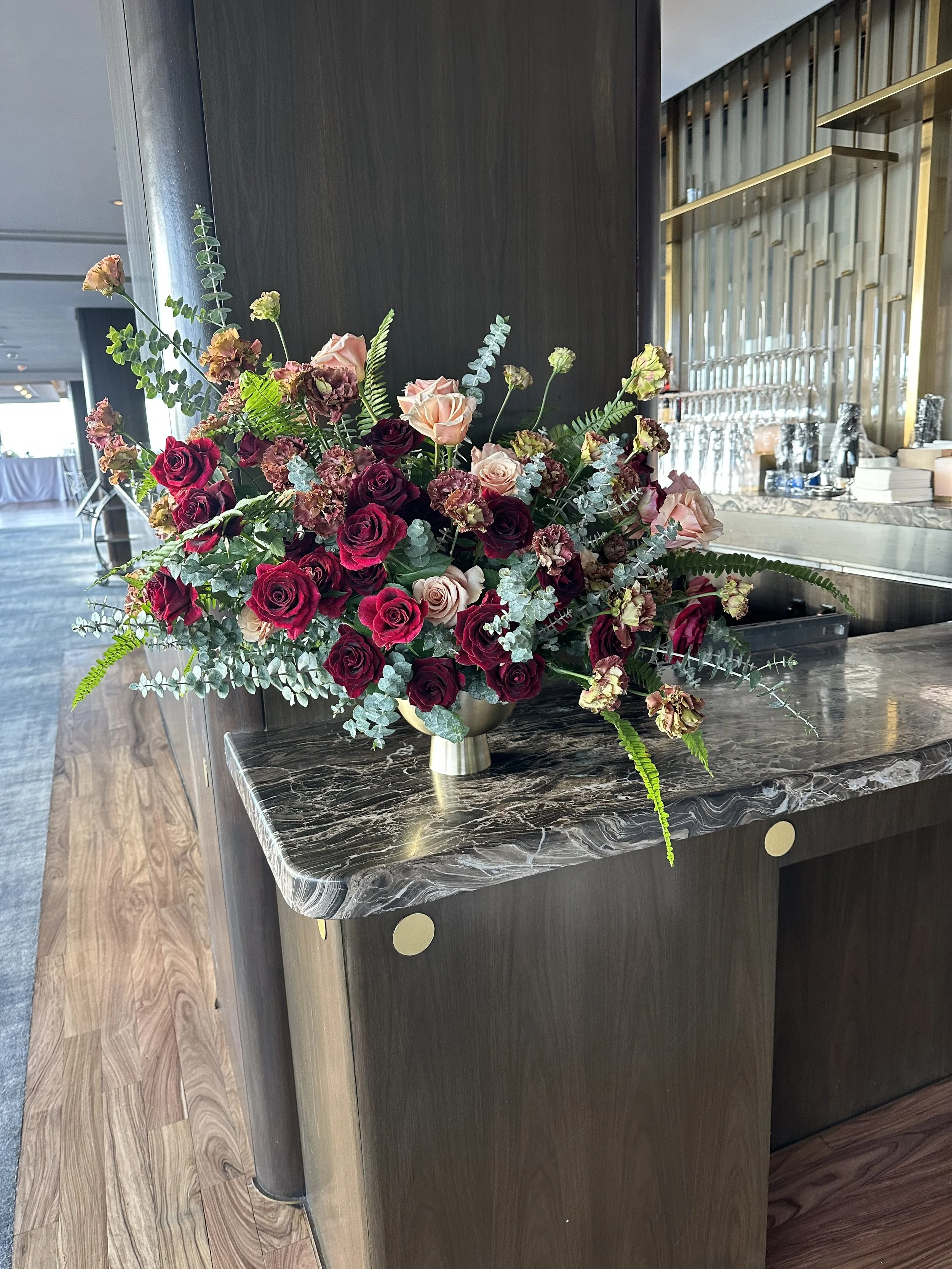 Dramatic statement floral arrangement in contemporary hotel lobby