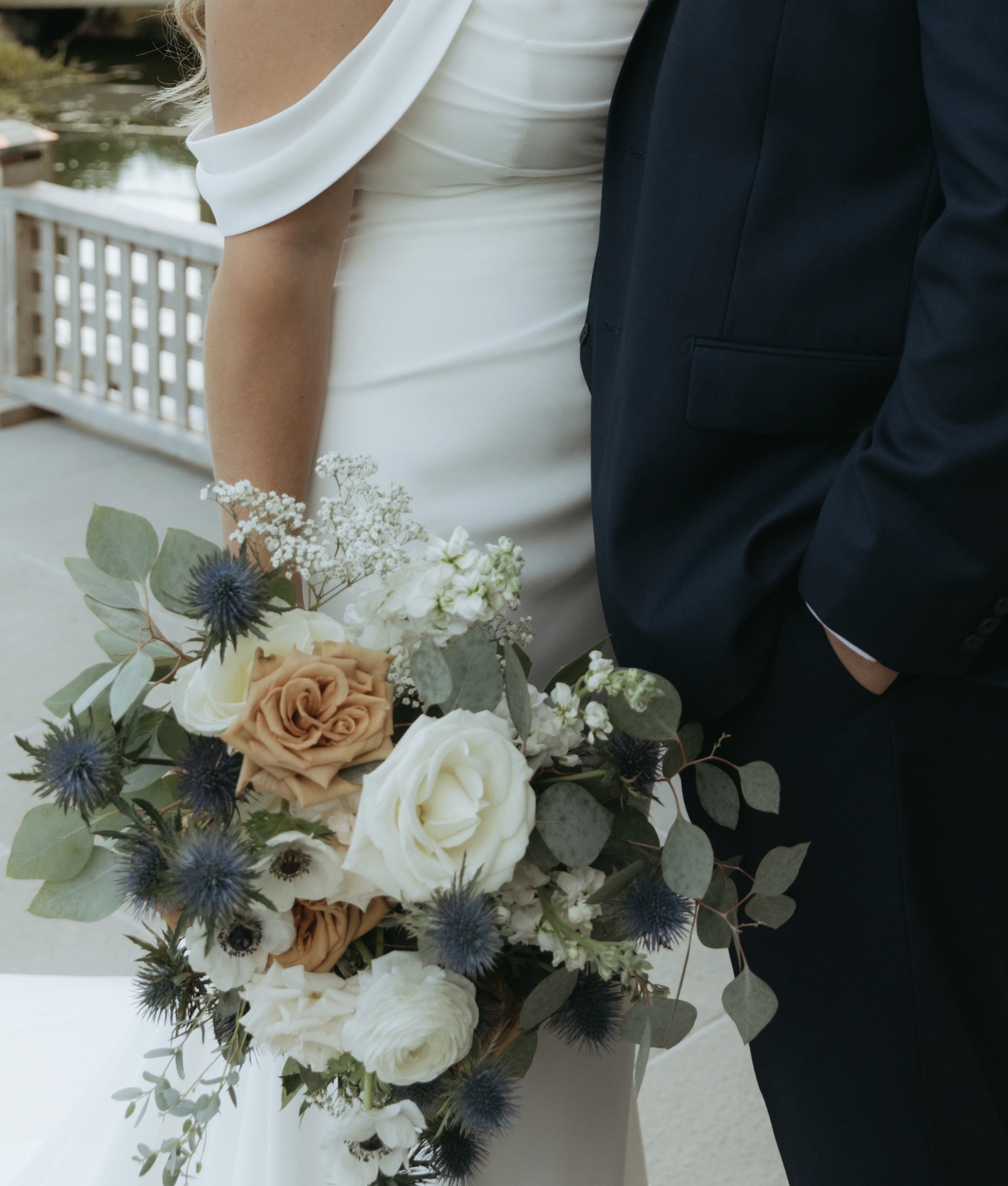 Romantic bridal bouquet with blush roses, anemones, and eucalyptus by Nicole Link Designs.