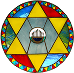 Colorful circular stained glass window with a central globe and six yellow triangles forming a Star of David pattern, surrounded by a decorative multicolored border.