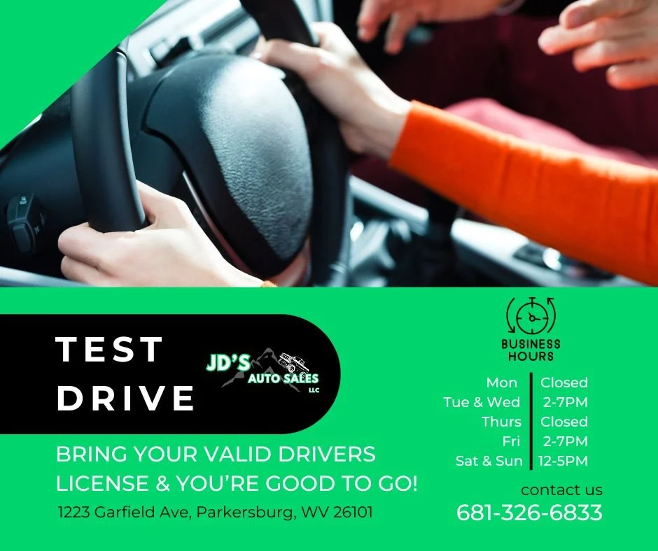 A test drive advertisement for JD's Auto Sales, LLC, featuring a person gripping a steering wheel inside a car, with dealership hours and contact information.