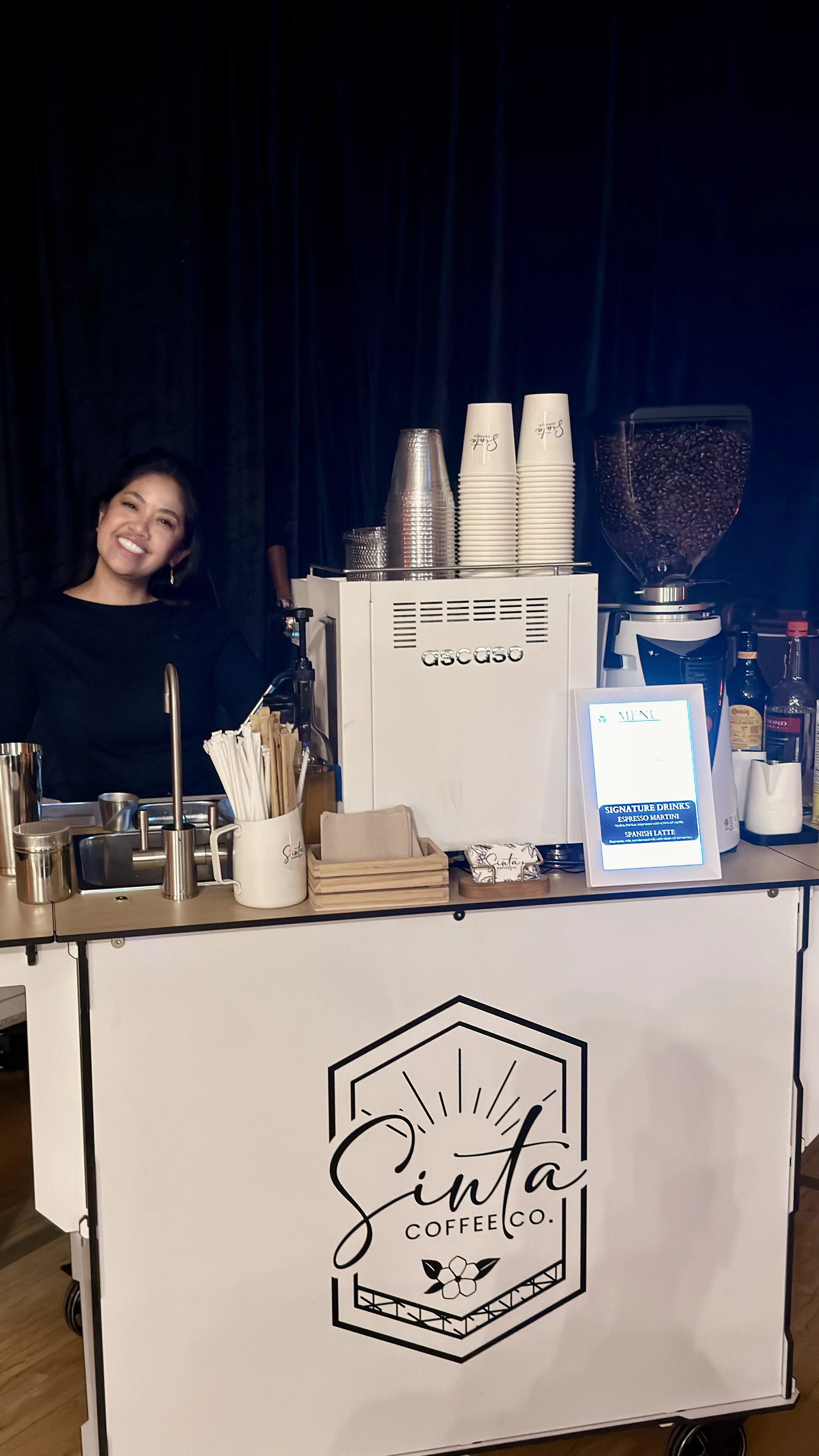 coffee cart. girl behind coffee cart. espresso machine.
