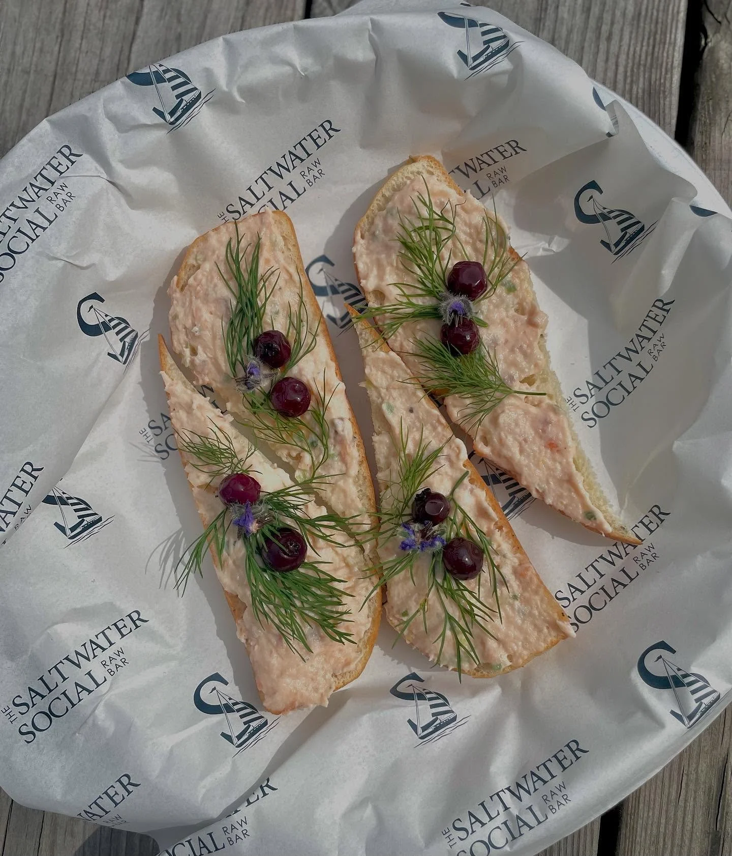 House made Smoked Salmon Mousse on Focaccia.

Delicate smoked salmon mousse layered on focaccia, topped with pickled blueberries and fresh dill.
A perfect balance of creamy, tangy, and herbaceous 🌿 

#thesaltwatersocialcb #foodtrucks #seafoodtruck #