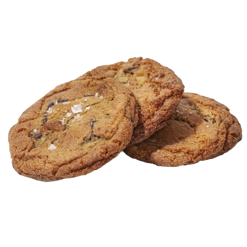 Close-up of three chocolate chip cookies stacked together.