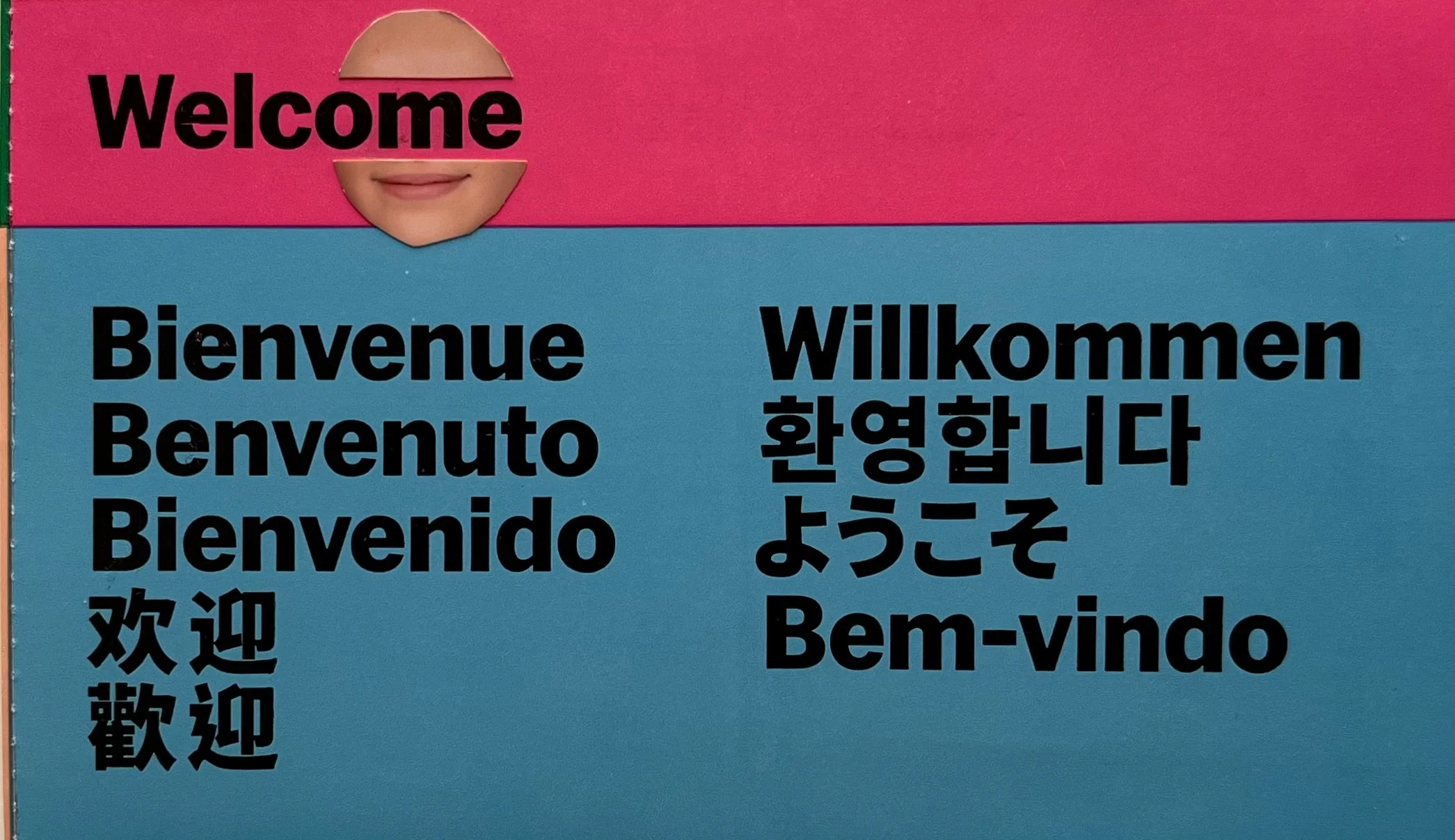 Sign with the word "Welcome" and its translations in multiple languages including French, Italian, Spanish, Chinese, Korean, and Portuguese.
