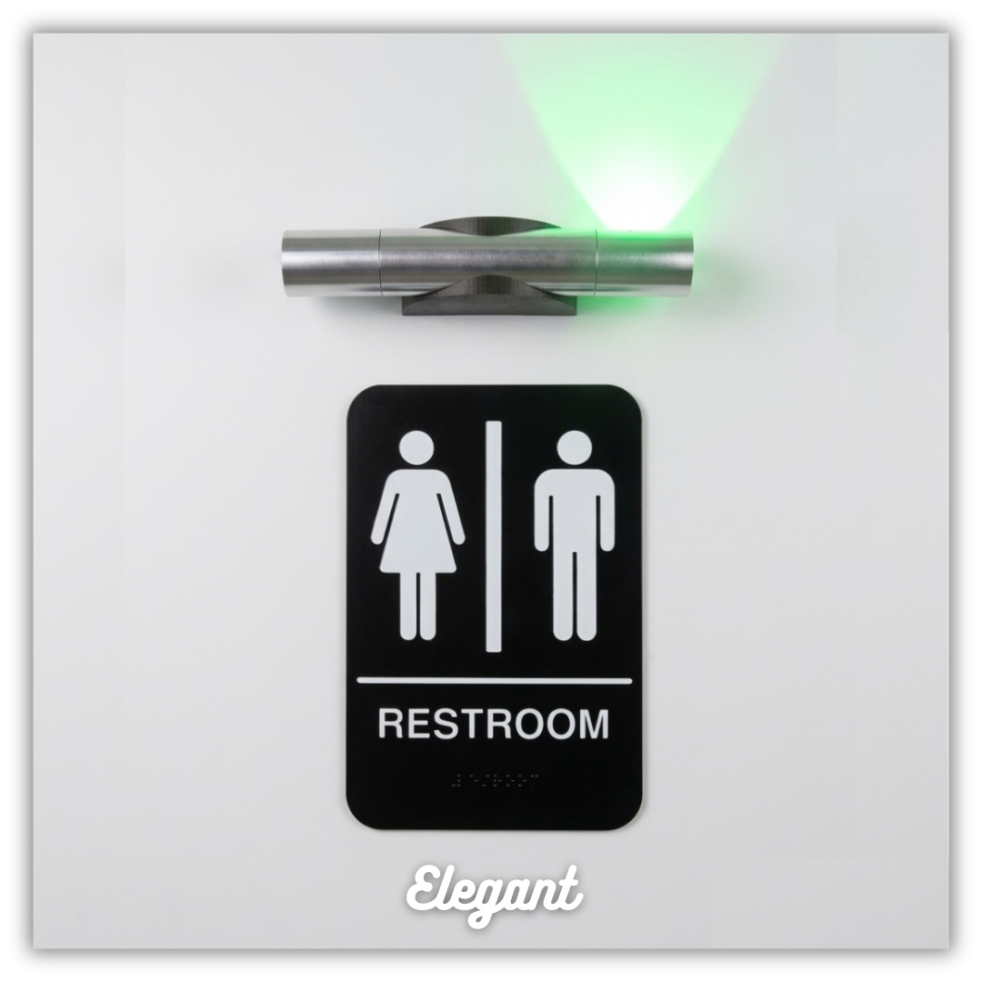 A restroom door with a black sign indicating male and female restrooms, a door sensor emitting a green light above the sign, and the word 'Elegant' at the bottom.