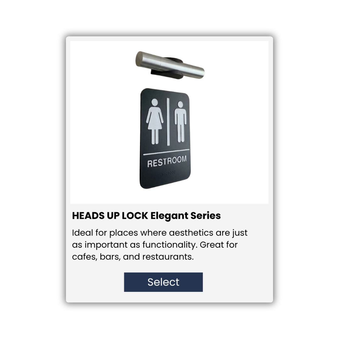 A digital advertisement for HEADS UP LOCK Elegant Series restroom signage, featuring a black restroom sign with male and female symbols, and a call-to-action button labeled 'Select'.