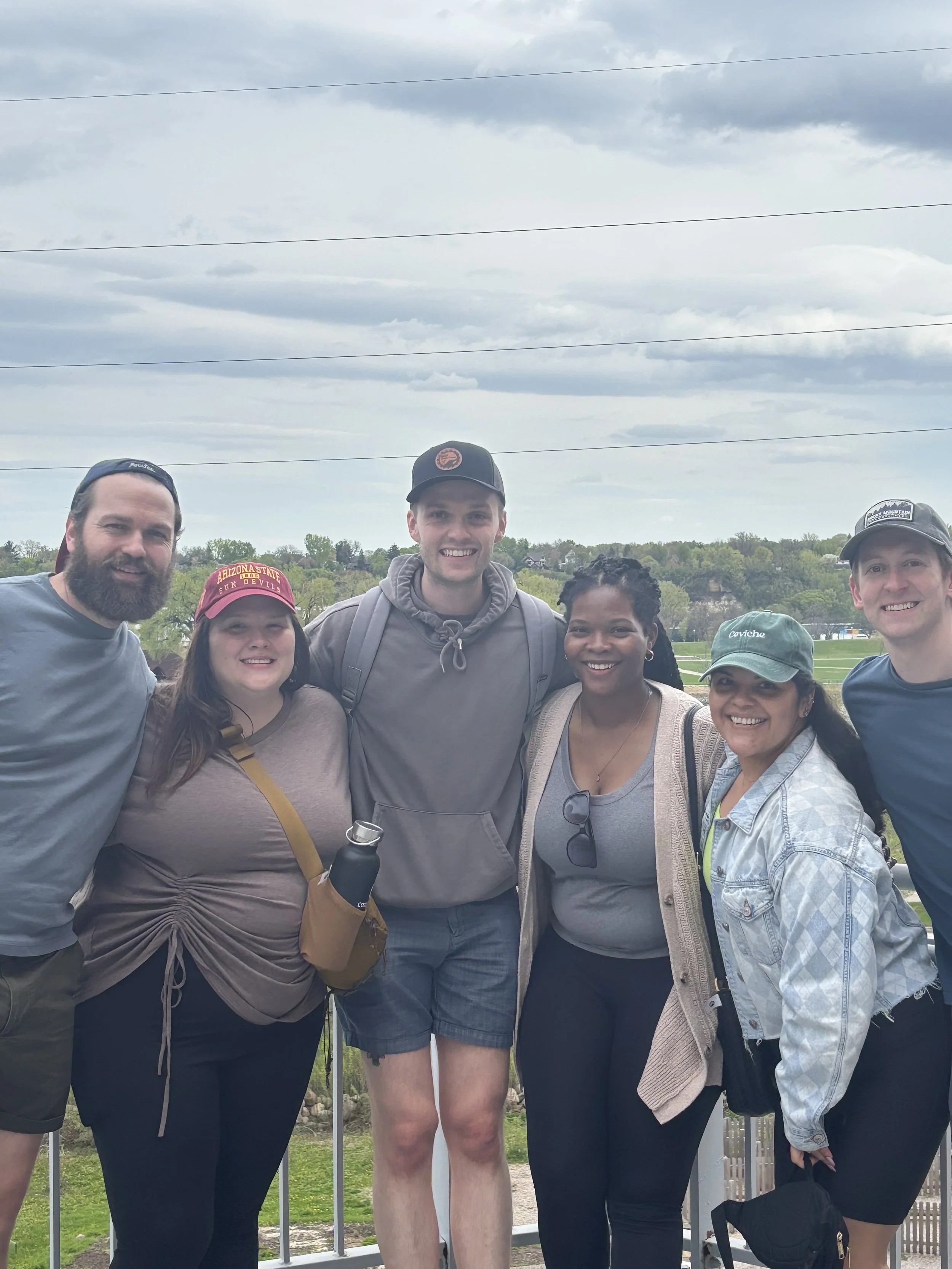 Group Picture in front of Mississippi river on MSP Food Tours food tour