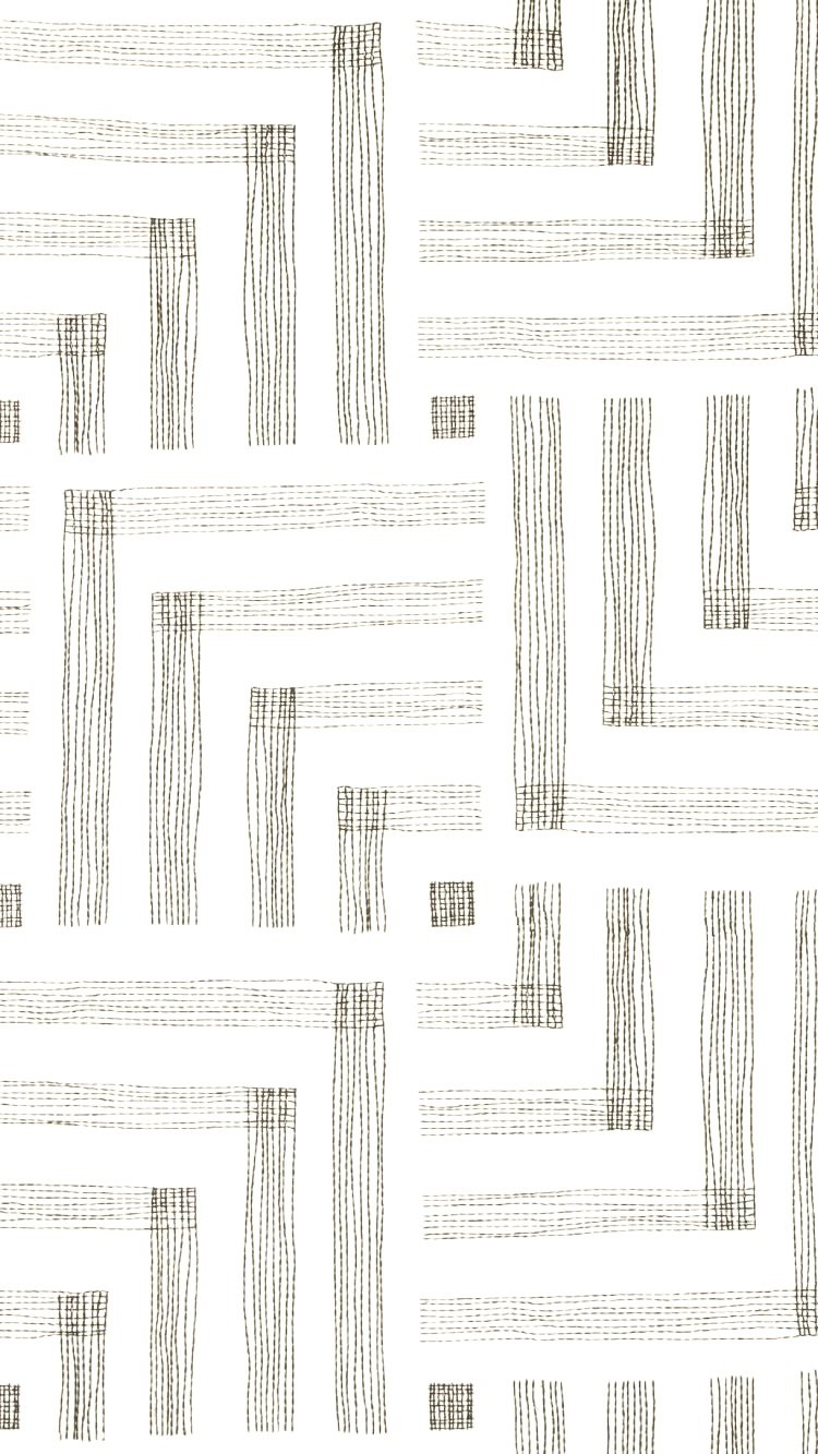 A white fabric with a black geometric pattern of rectangles and lines.