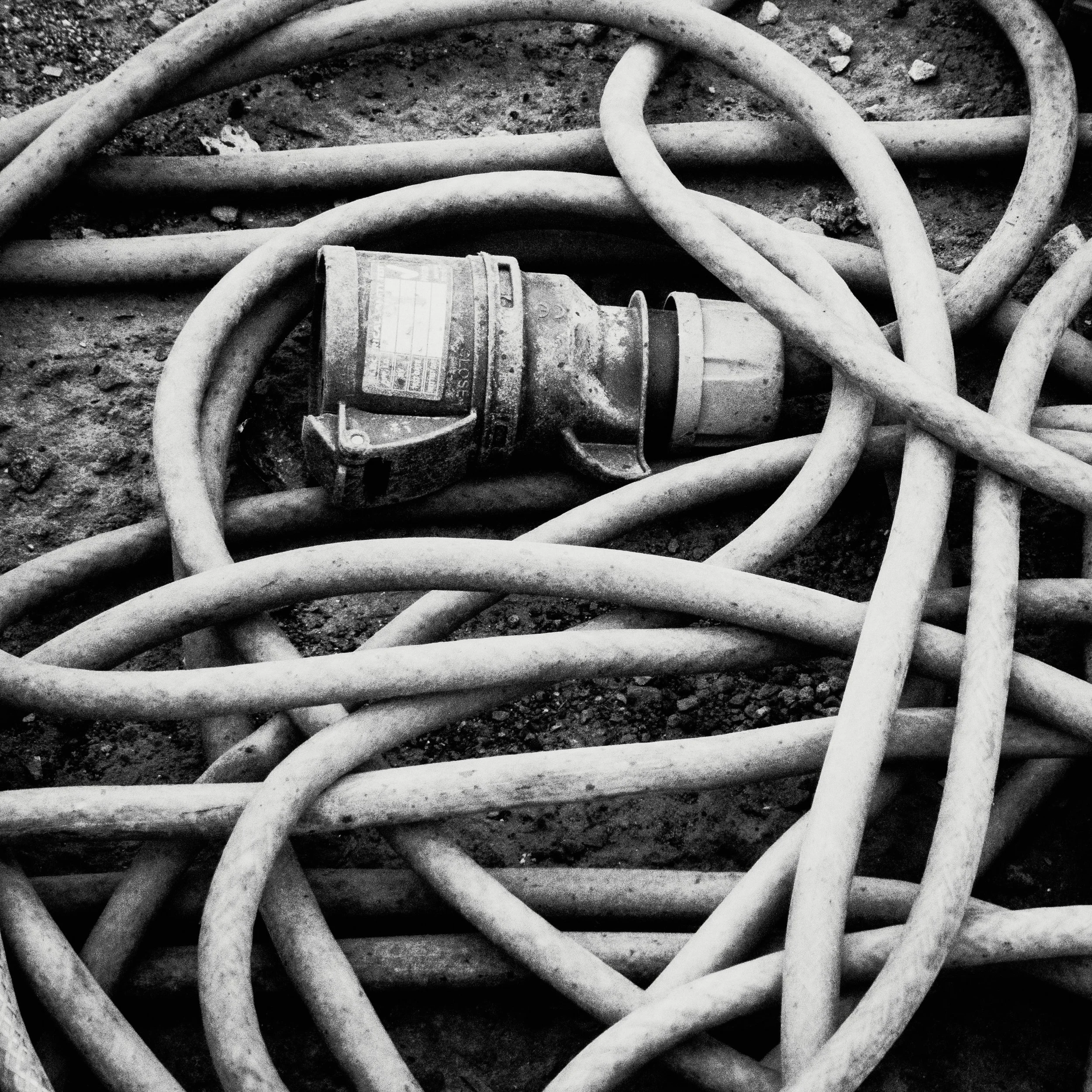 Power cables crisscrossing the site ground.