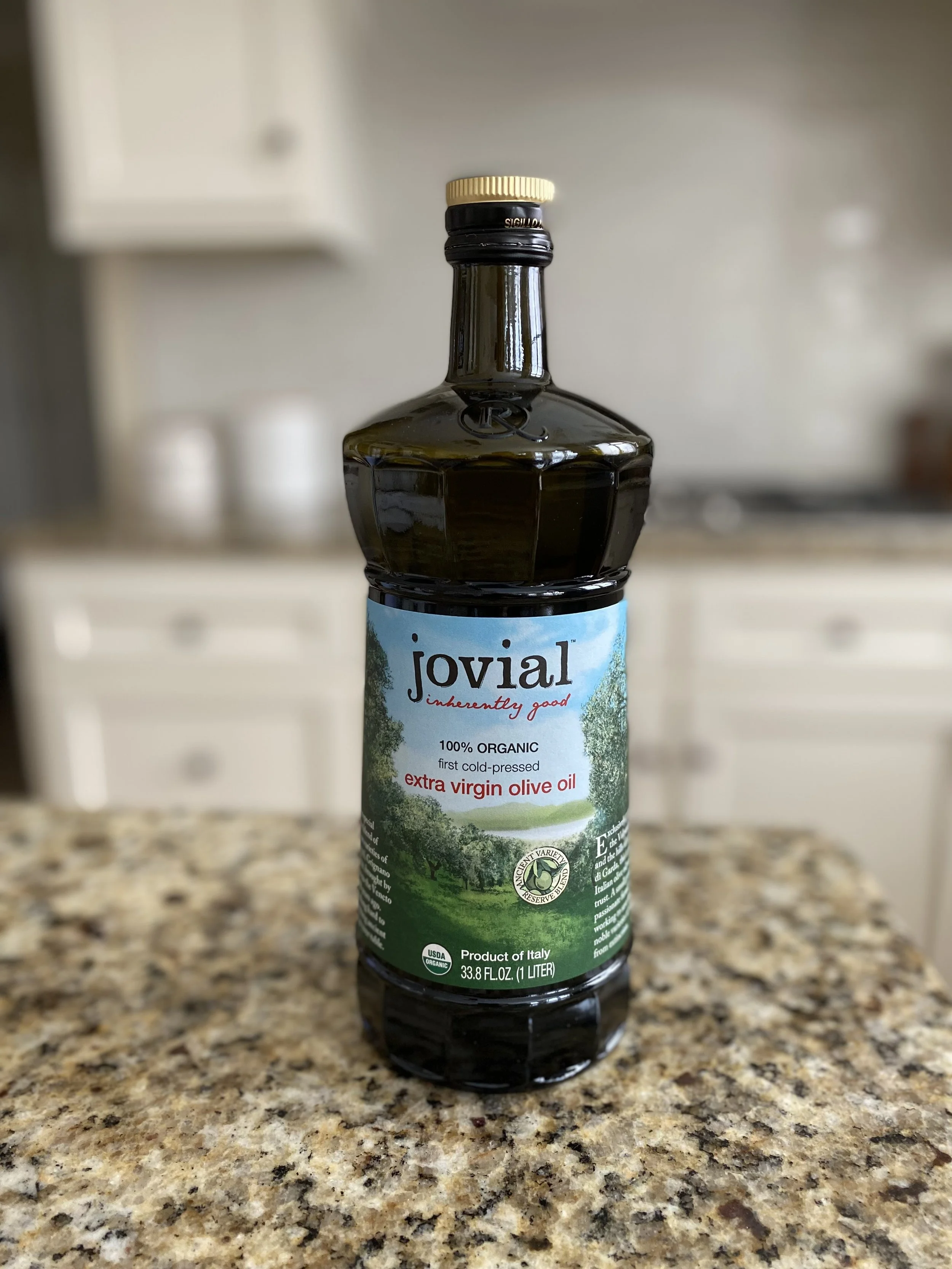 Jovial organic extra virgin olive oil drizzled over an Italian tomato and mozzarella platter