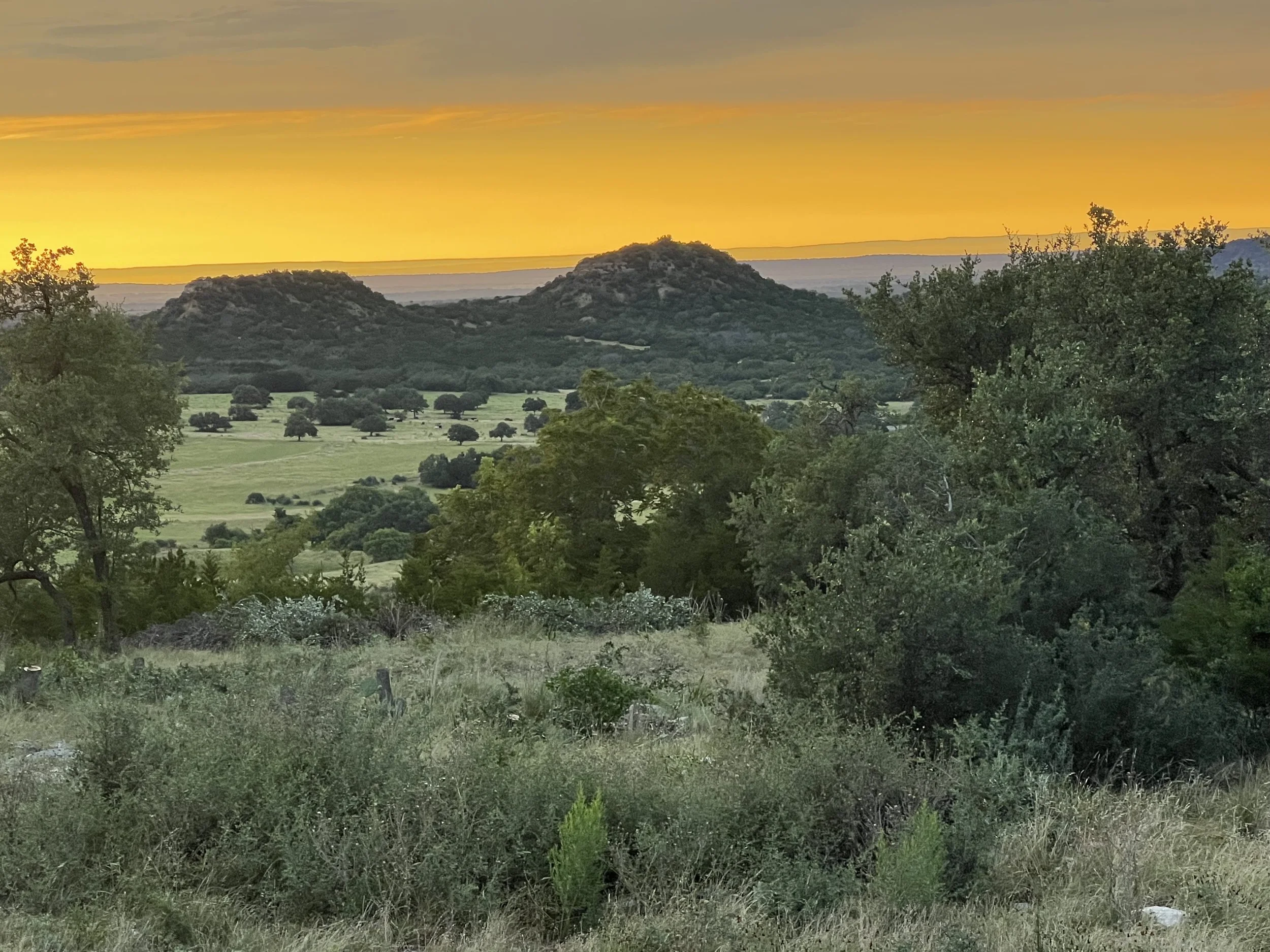 Sunset over the Farmopathy hilltop in the Texas Hill Country