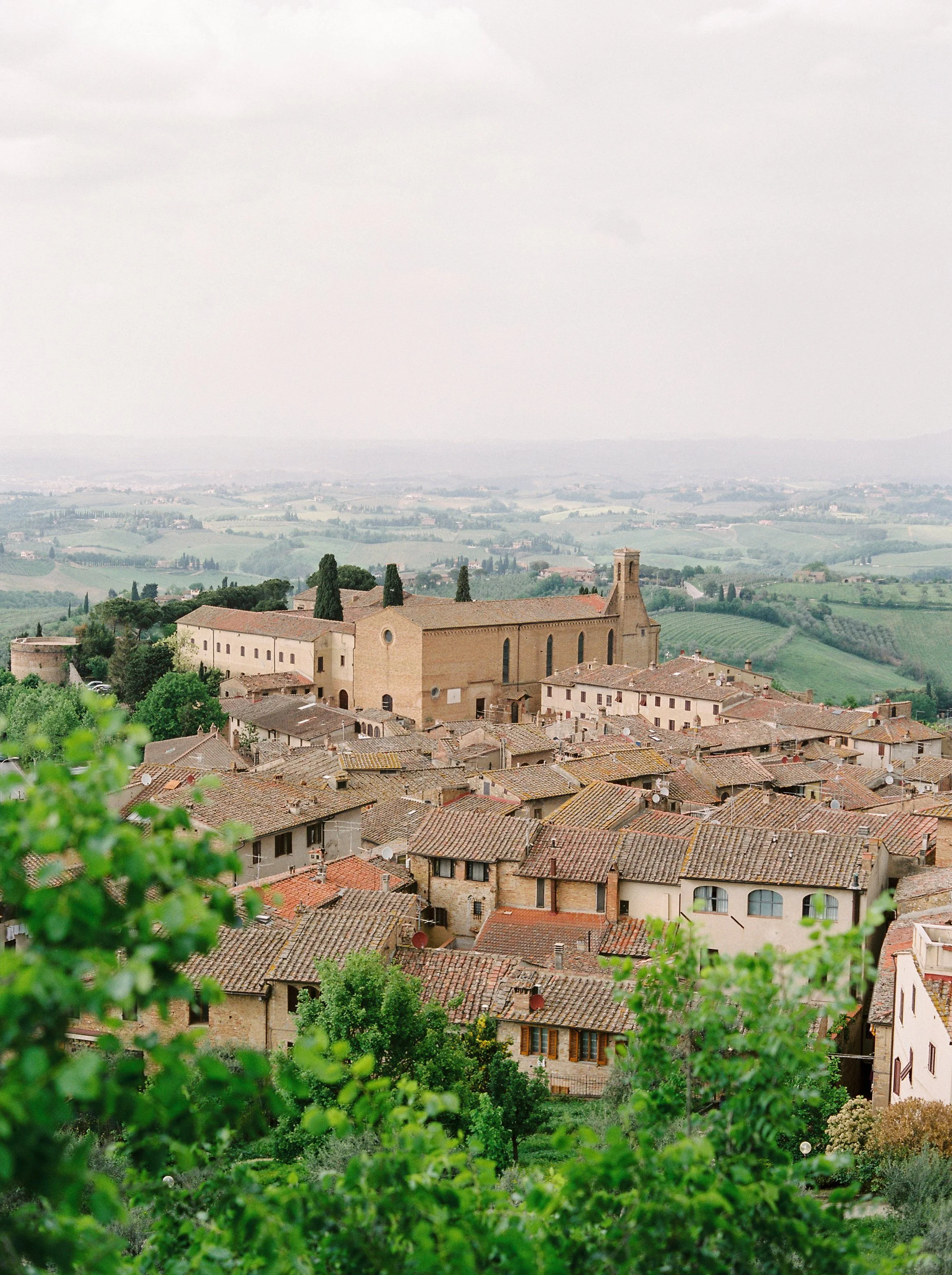 Overlook of an Italian village nestled in rolling hills, symbolizing community, tradition, and intentional living.
