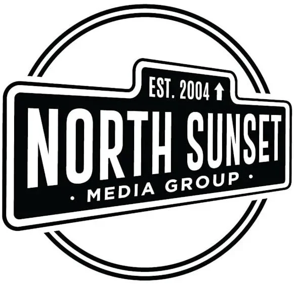 Logo of North Sunset Media Group, established in 2004, in black and white with circular design.