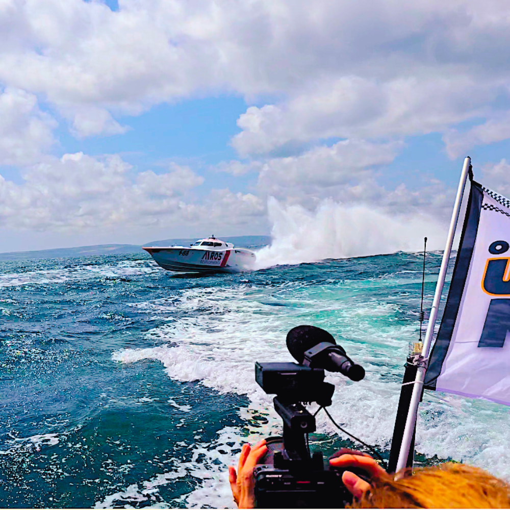 attitude media filming uk offshore powerboat racing  fountain at speed passing