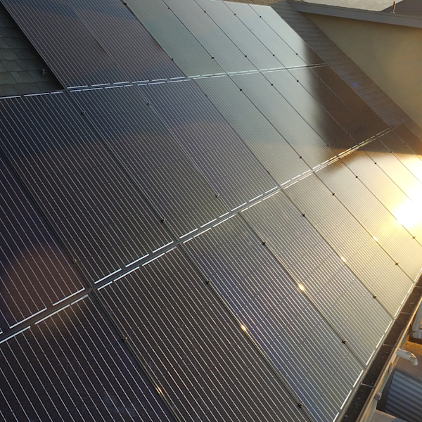 Close-up of solar panels installed on a roof.