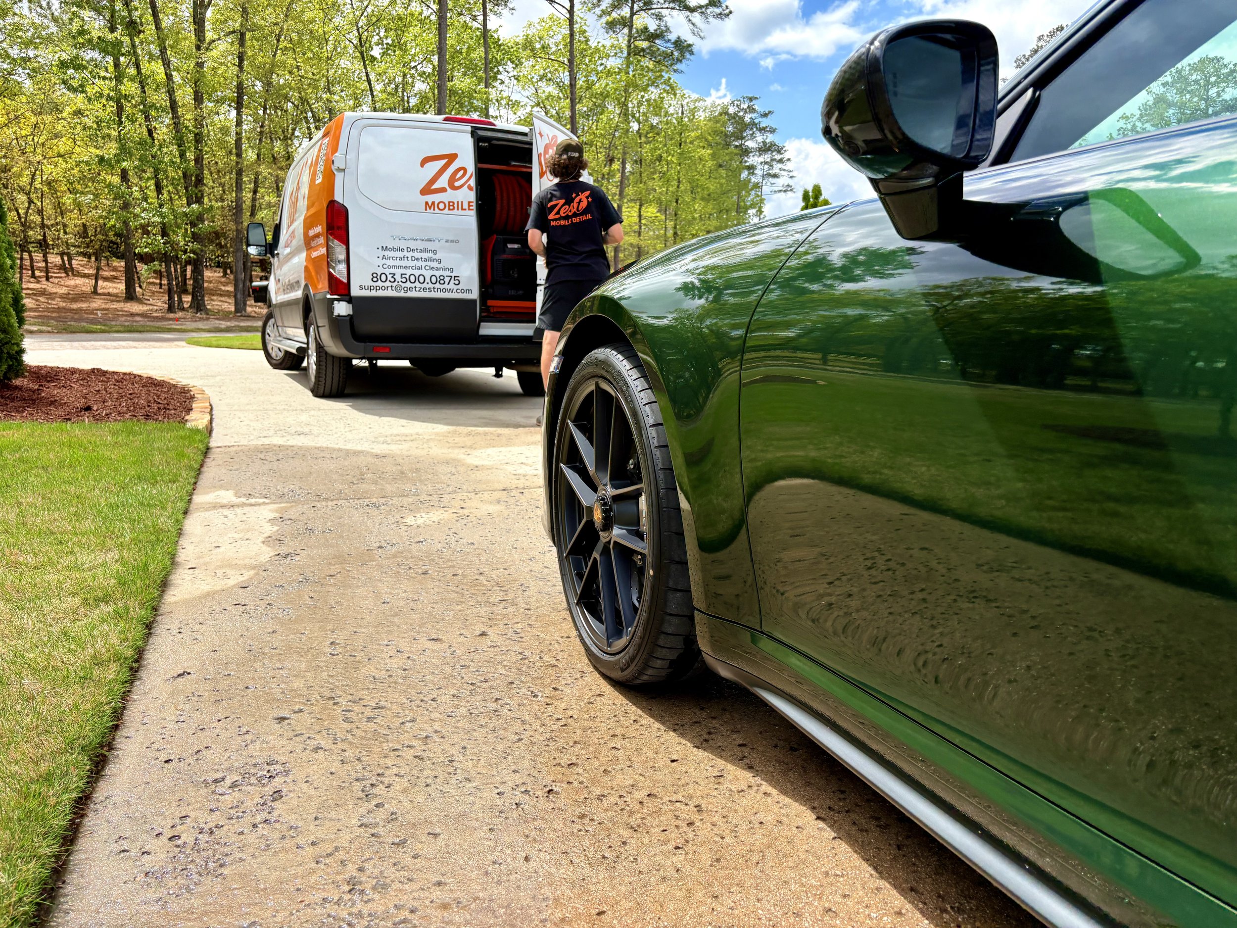#1 Google Rated Zest Mobile Detail service van beside a freshly detailed Porsche in Blythewood, SC.