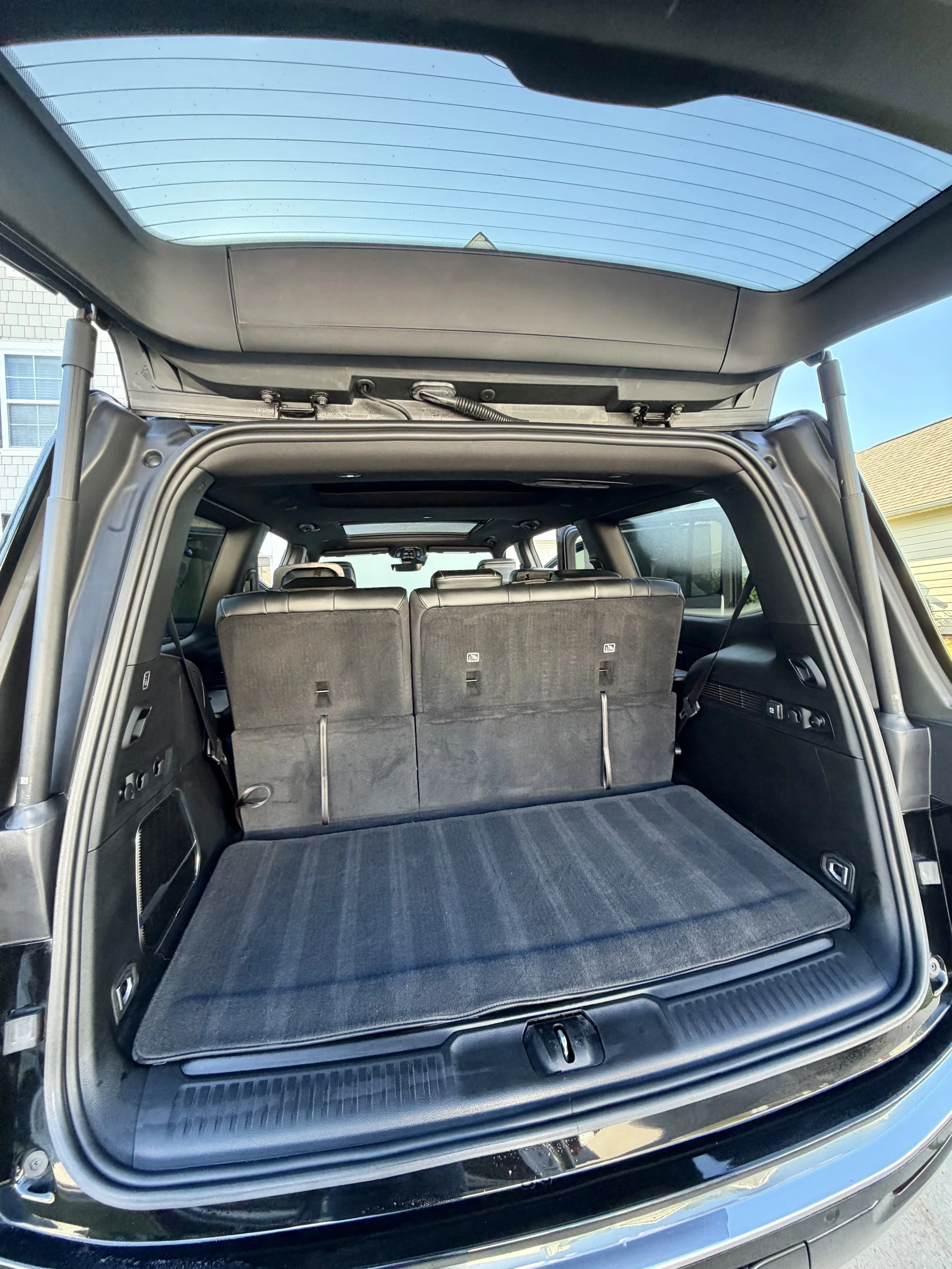 The cargo area of a full-size SUV after receiving a professional interior detail from Zest Mobile Detail. Our mobile detailing team thoroughly cleans carpets, cargo areas, seating surfaces, interior panels, and hard-to-reach areas to restore a clean,