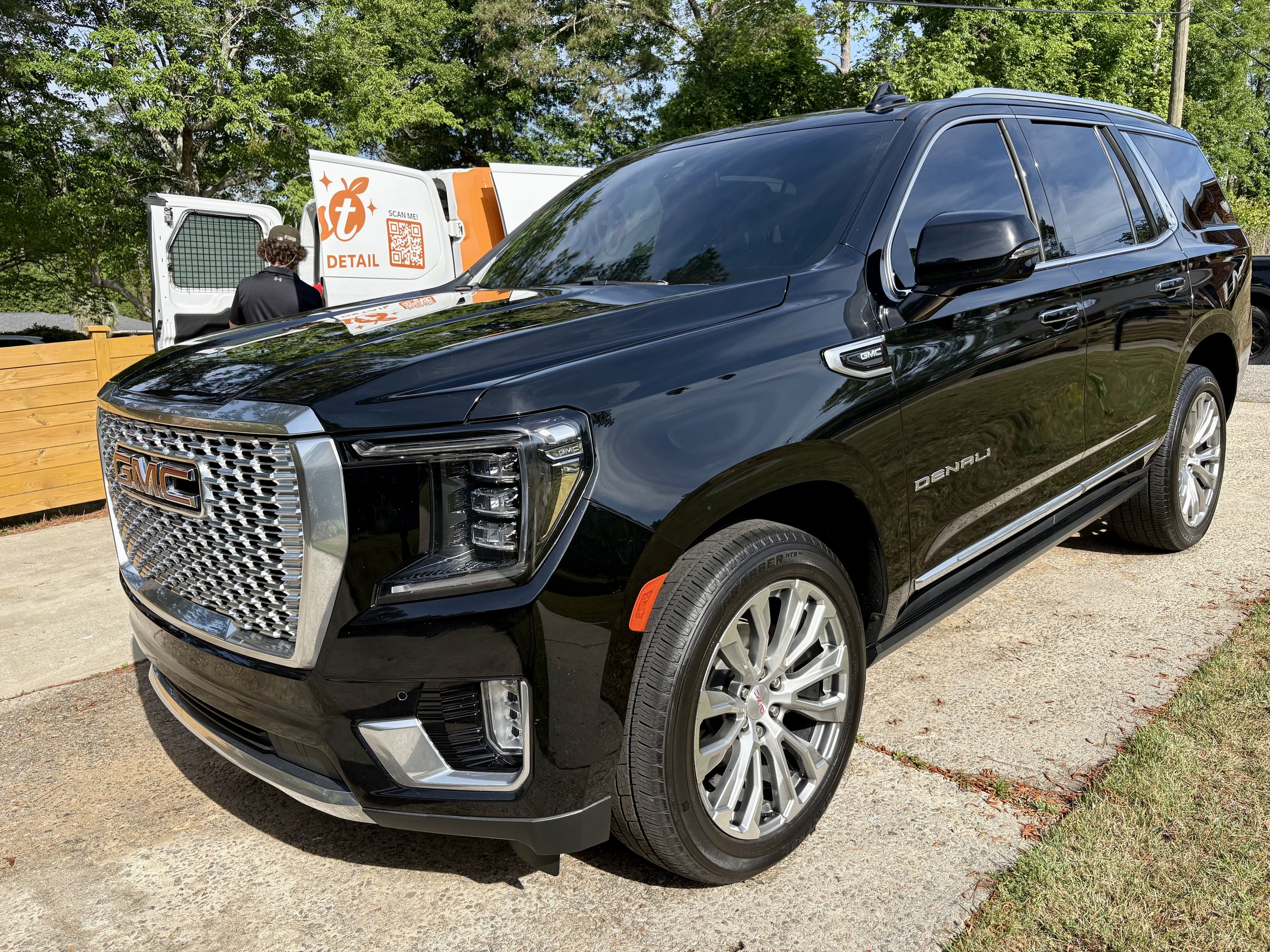 #1 Google Rated Zest Mobile Detail service van beside a freshly detailed GMC Yukon Denali in Forest Acres, SC.