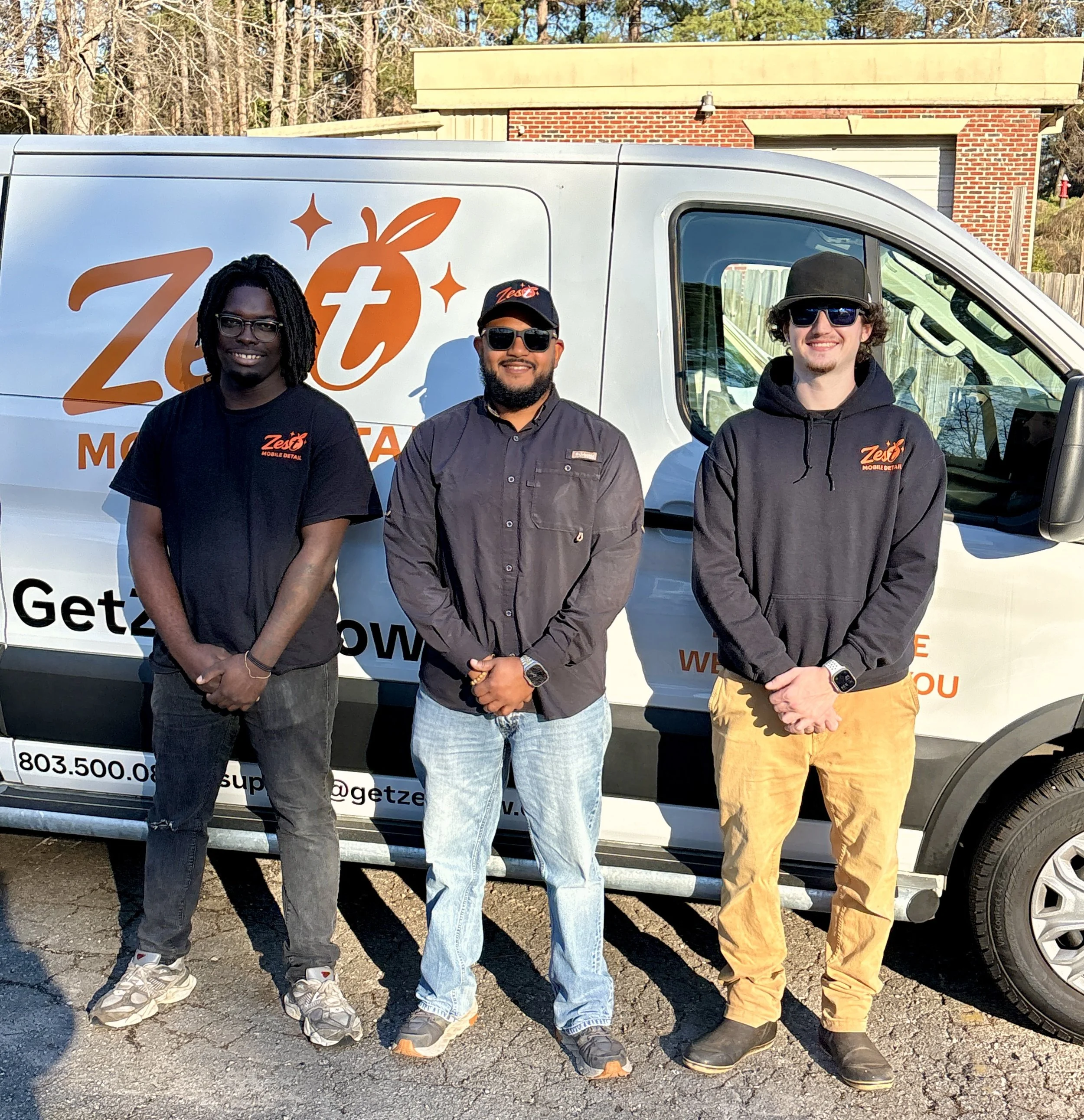 Zest Mobile Detailing team standing in front of mobile detailing van providing professional at-home car detailing in Columbia South Carolina