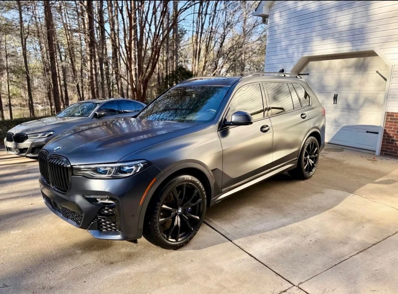 Silver BMW SUV and BMW sedan professionally detailed at home by mobile car detailing service in Columbia South Carolina