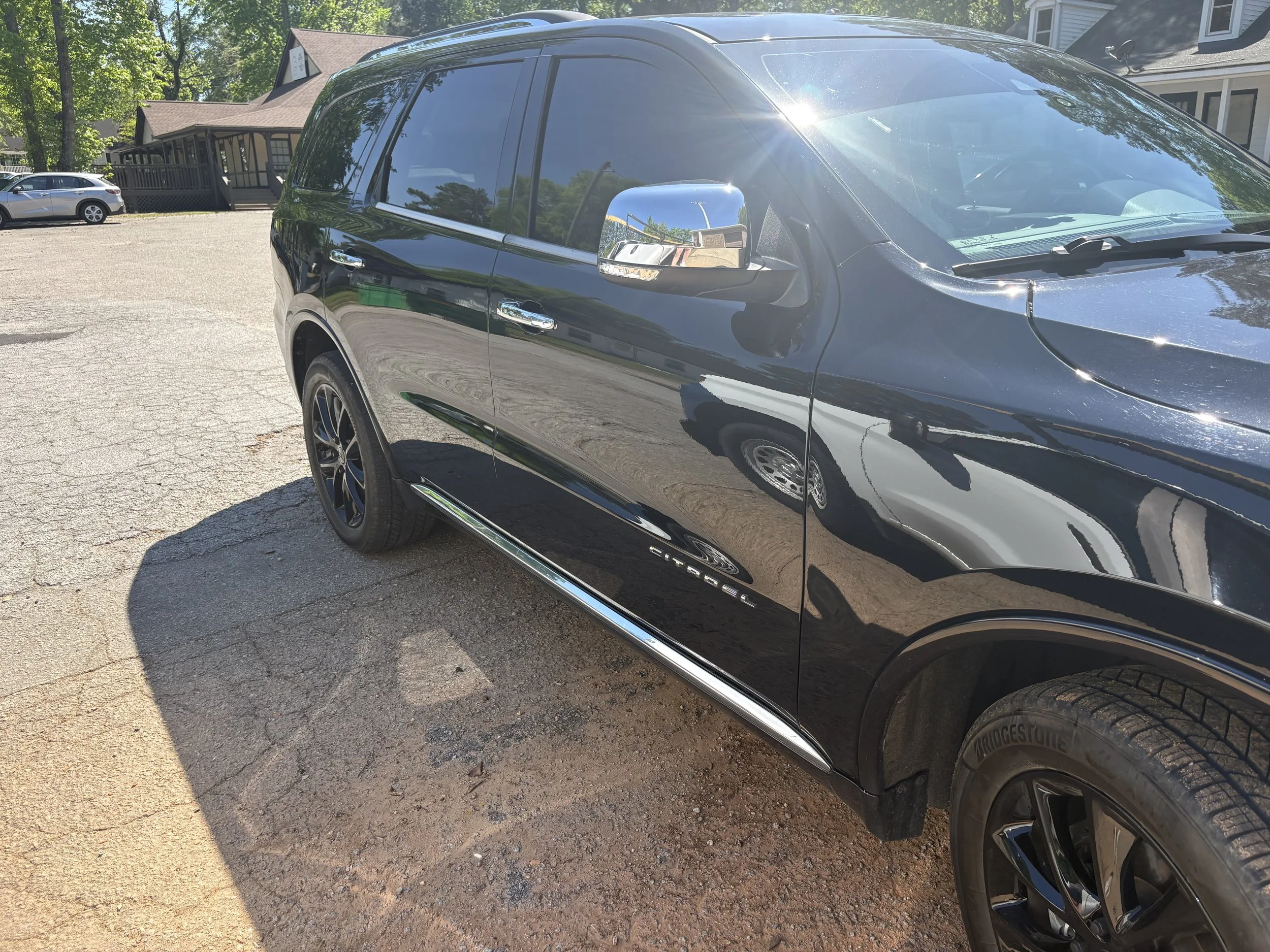 Black Dodge Durango after a professional paint polish and exterior detail by Zest Mobile Detail in Lexington, SC, featuring deep gloss enhancement, swirl reduction, restored black paint clarity, and premium mobile detailing service.