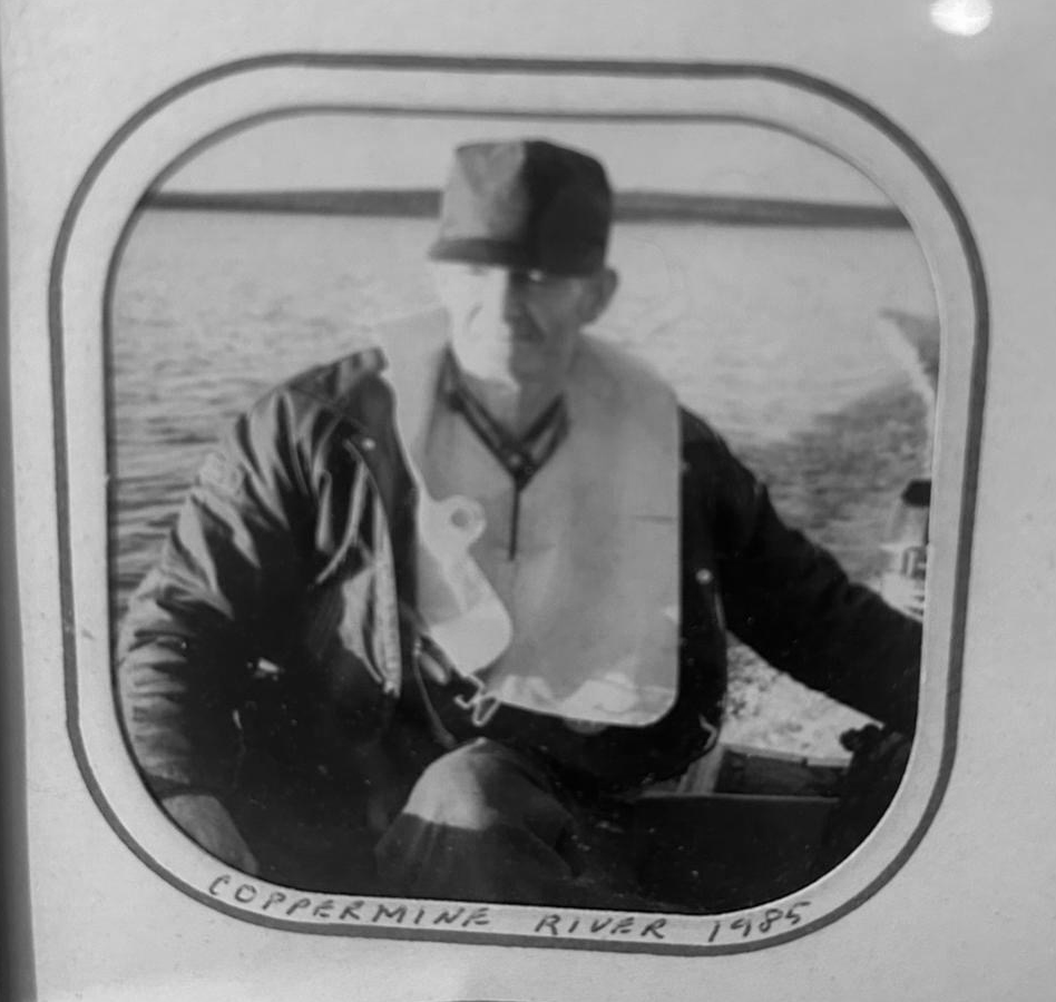 Man in boat wearing life jacket