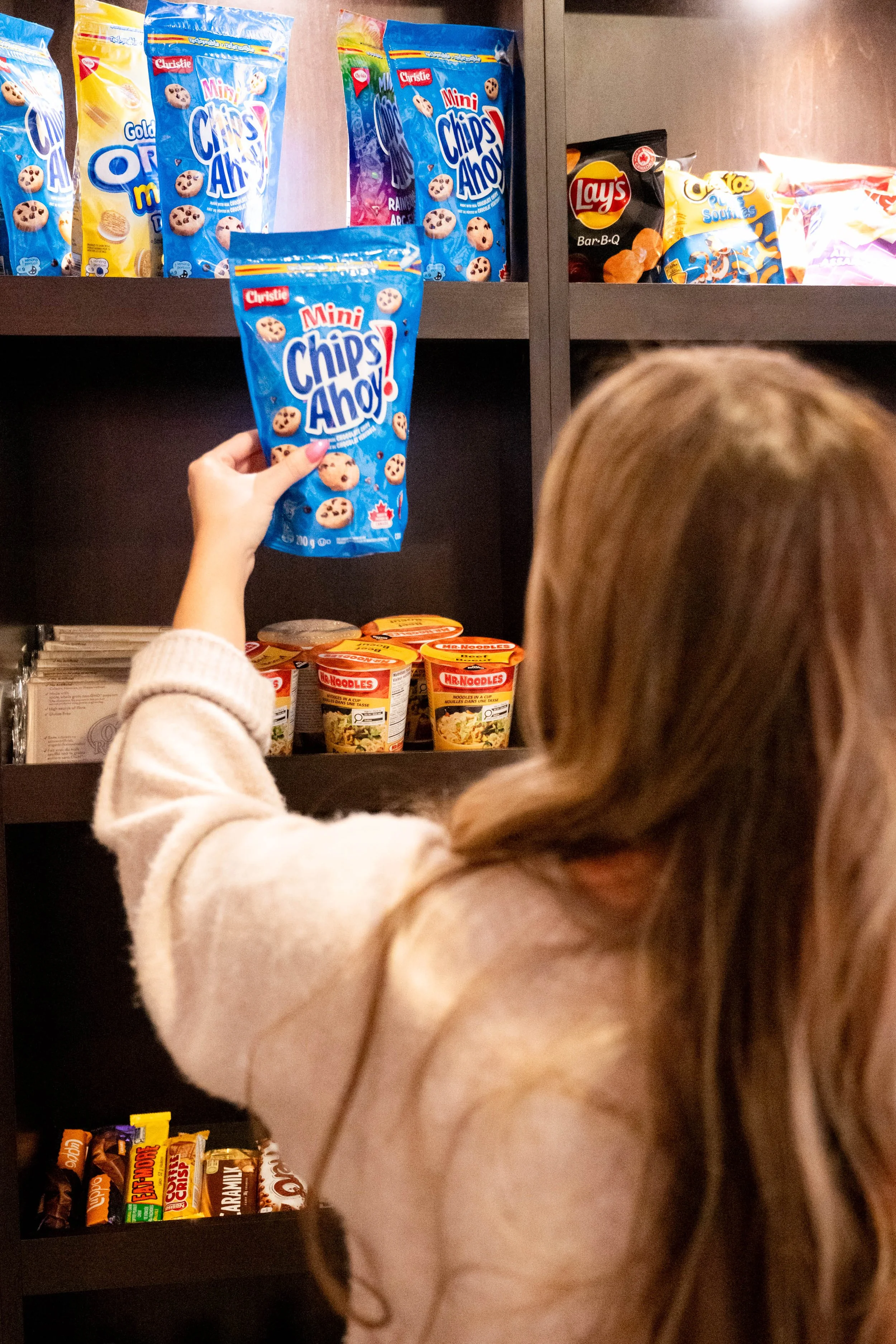 Hotel convenience store with snacks, drinks, and travel essentials at Denham Inn & Suites in Leduc