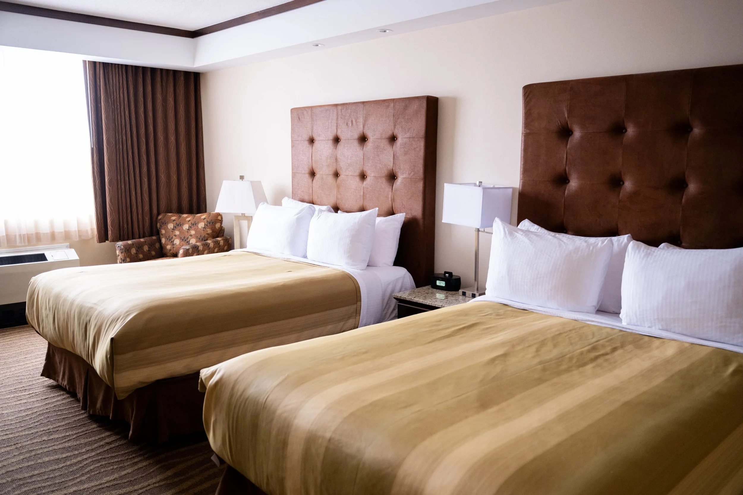 Double Queen Deluxe room perfect for families and friends at Best Western Premier Denham Inn & Suites near Edmonton International Airport