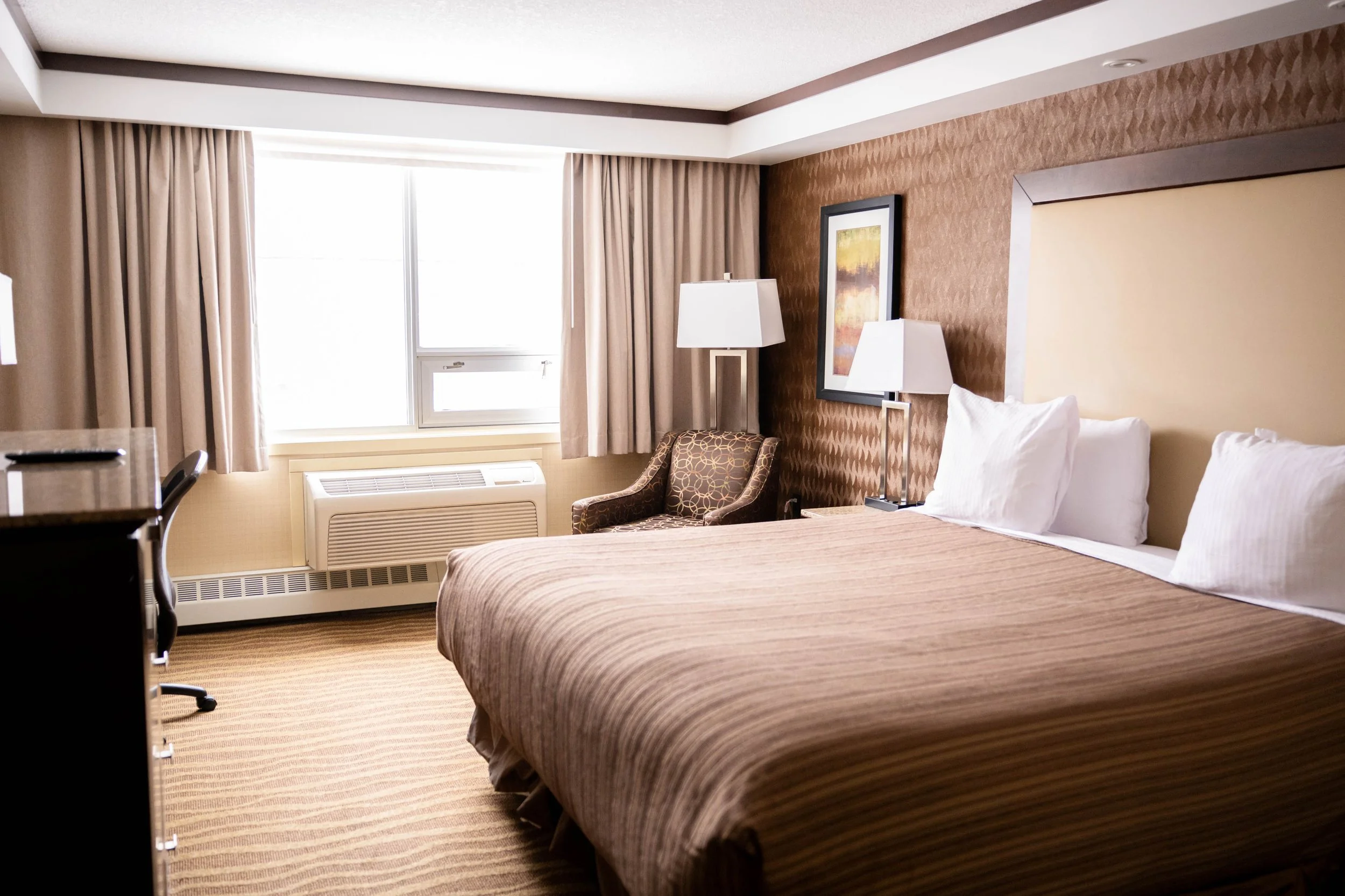 Deluxe King Suite comfortable for solo stays or couples at Best Western Premier Denham Inn & Suites near the Edmonton International Airport