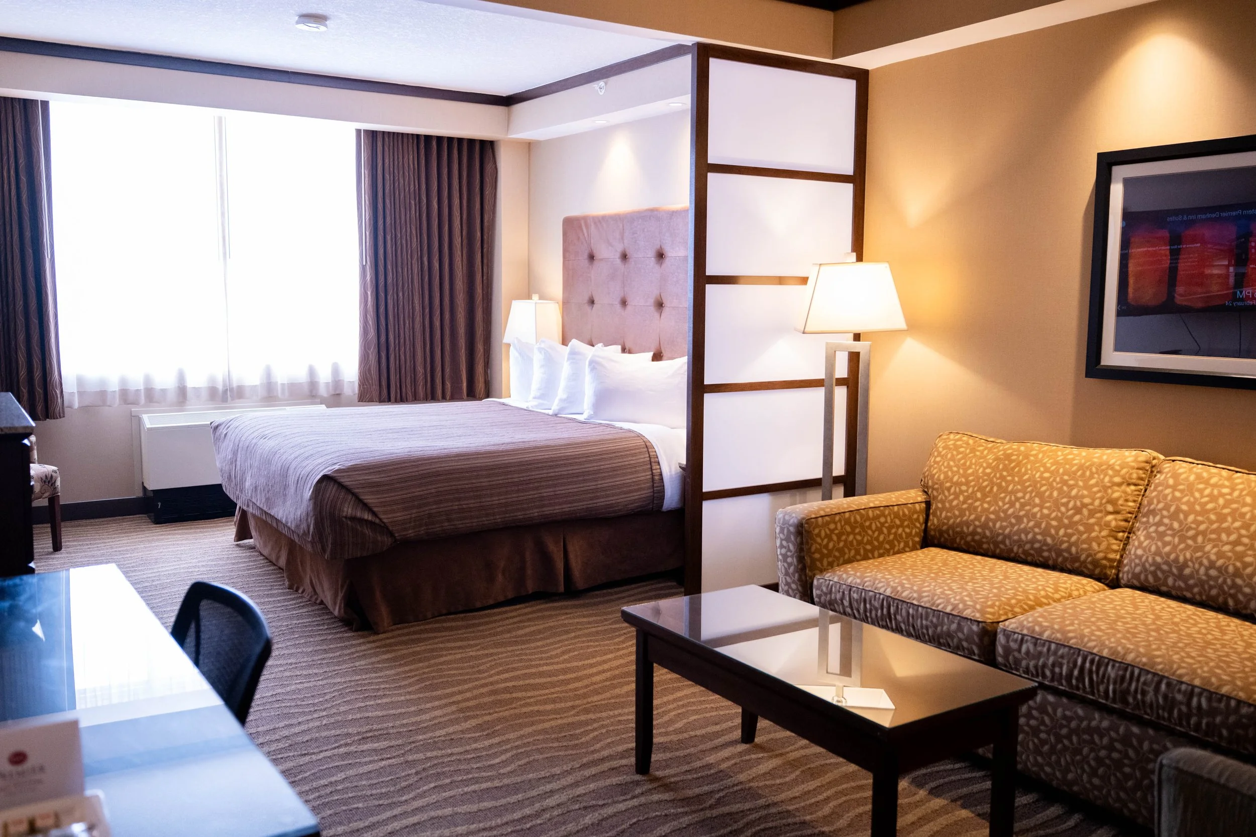 King Mini-Suite with extra living space or sleeping space at Best Western Premier Denham Inn & Suites near Edmonton International Airport.