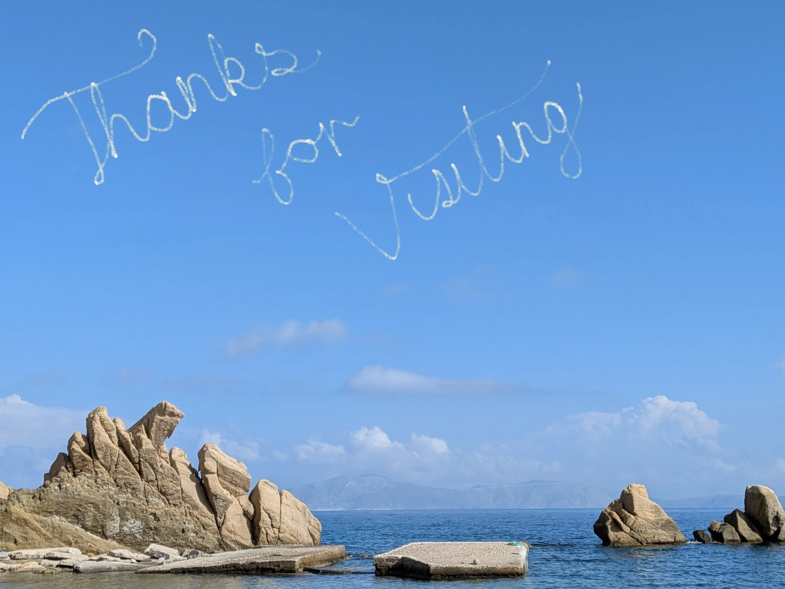 A scenic view of a rocky shoreline with large rock formations in the sea, under a bright blue sky with some clouds. The words 'Thanks for Visiting' are written in the sky as if in chalk.