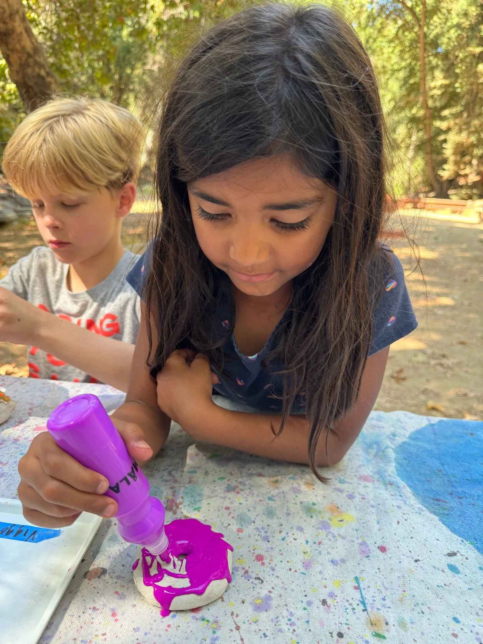 Why squeeze paints? Squeezing a paint bottle builds fine motor strength, it feels good, and it's FUN!